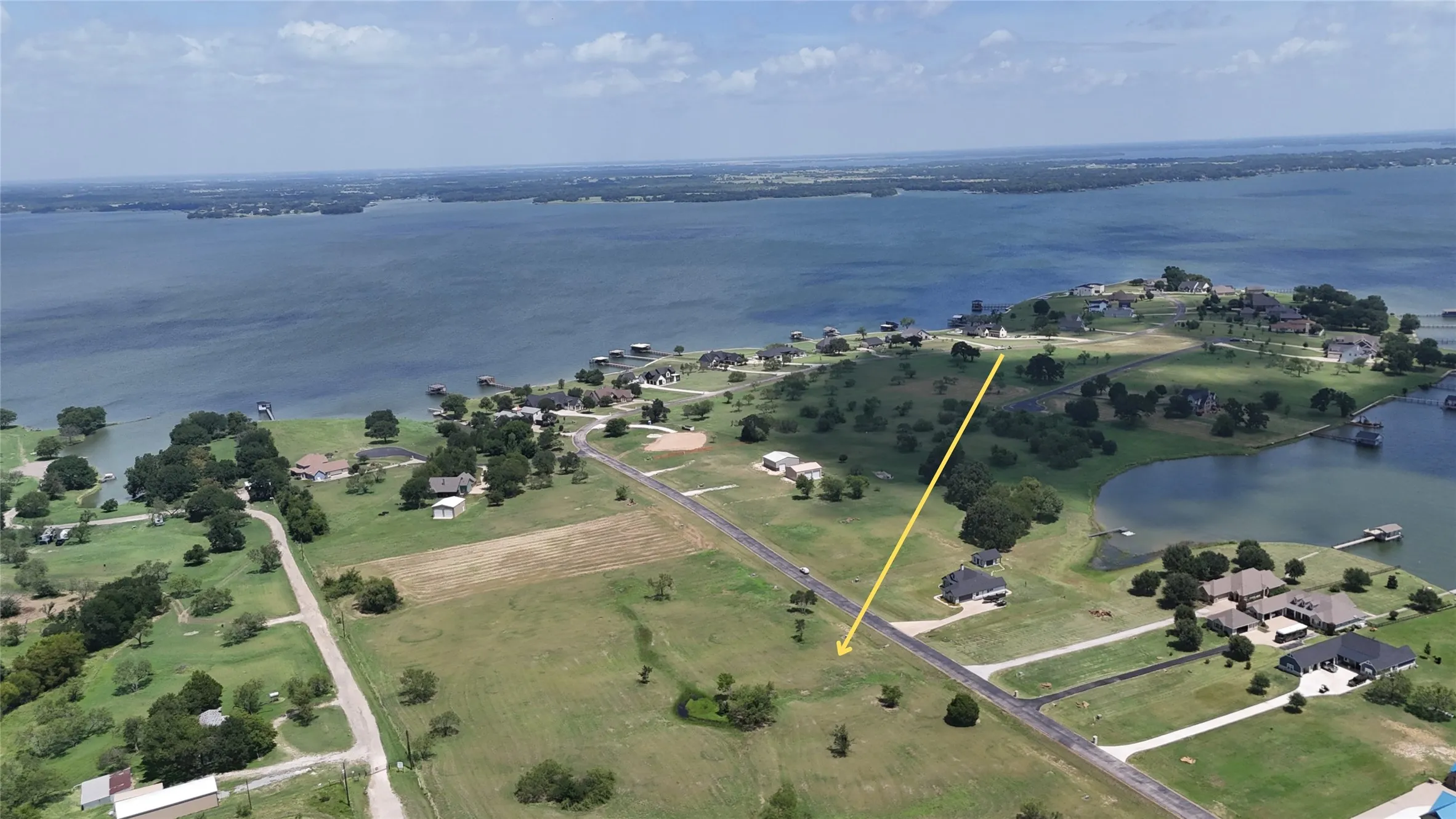 Aerial perspective showcasing the home site's proximity to open water.