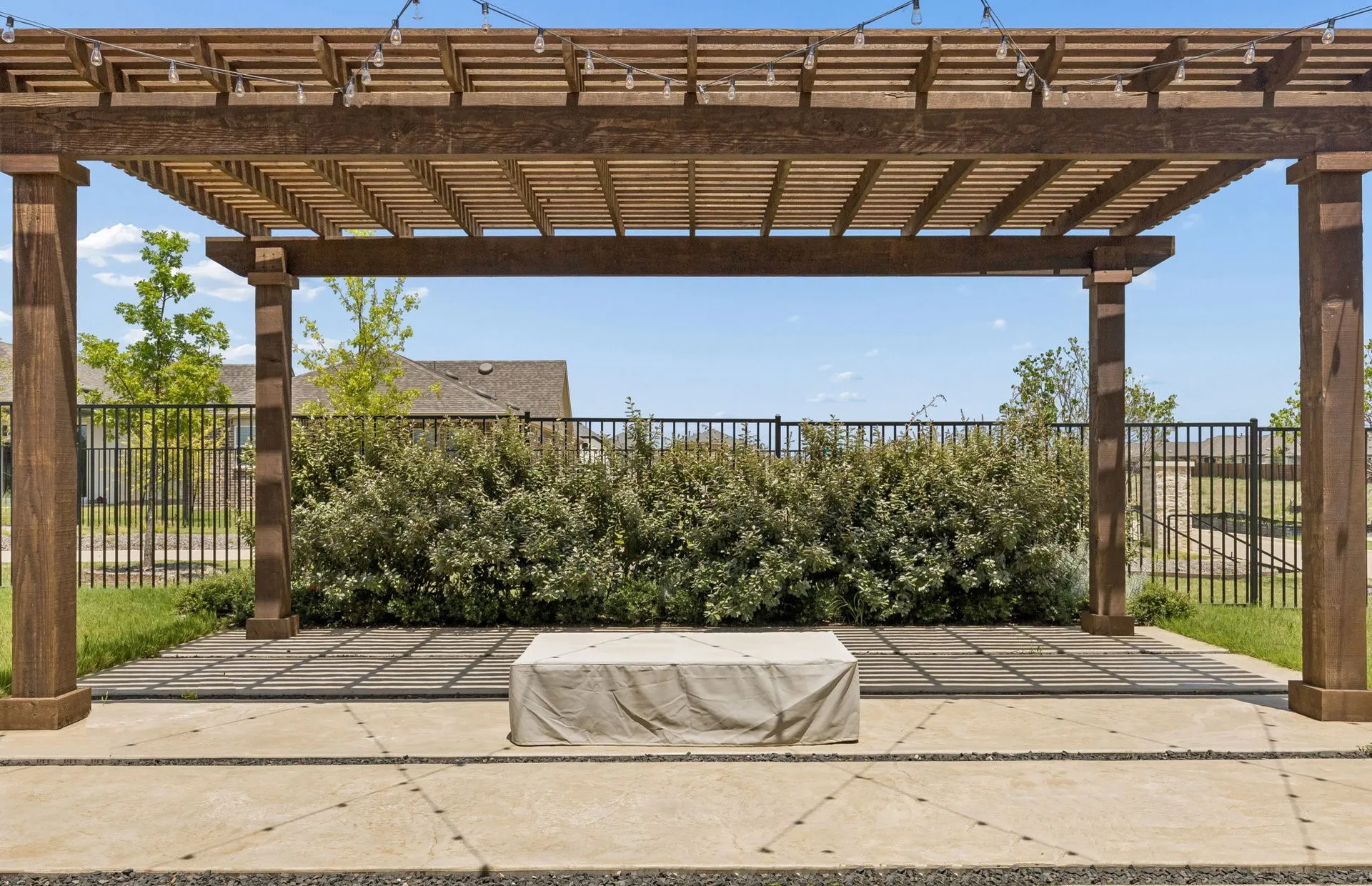 Pergola on back patio with outdoor fireplace