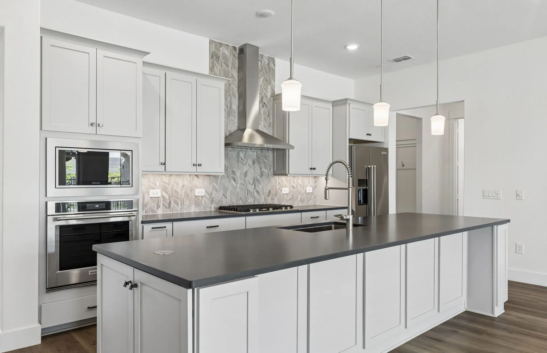 Eat-in island kitchen with pendant lighting
