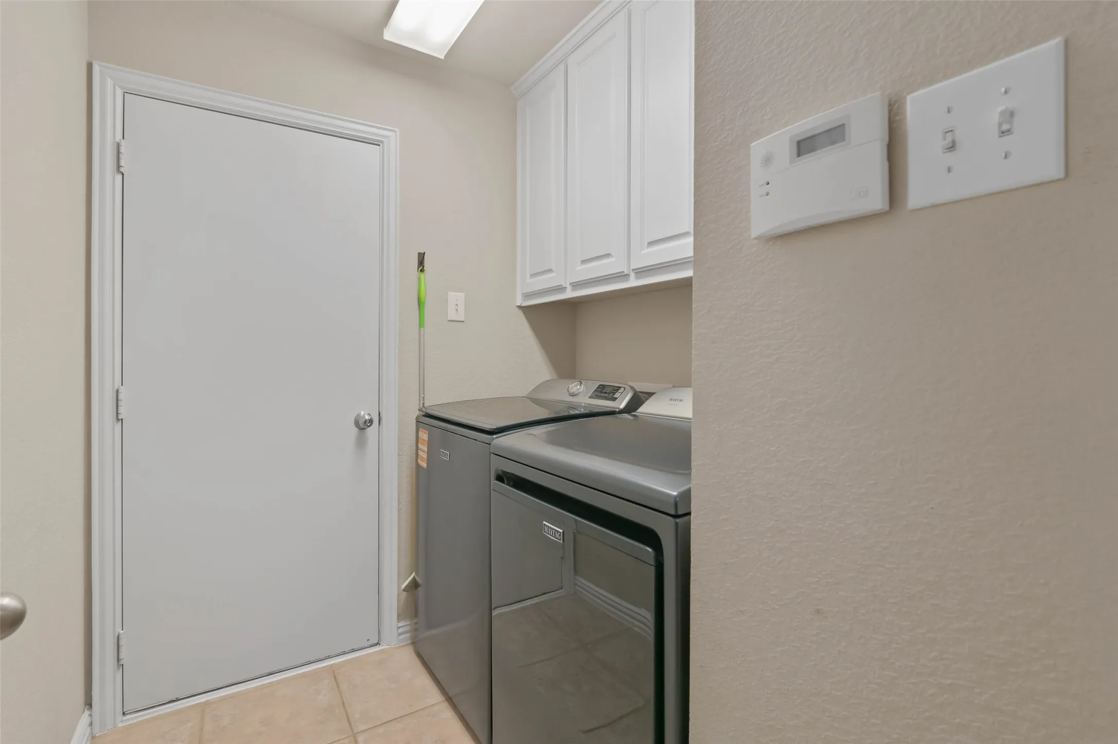 Laundry room with access to the garage.