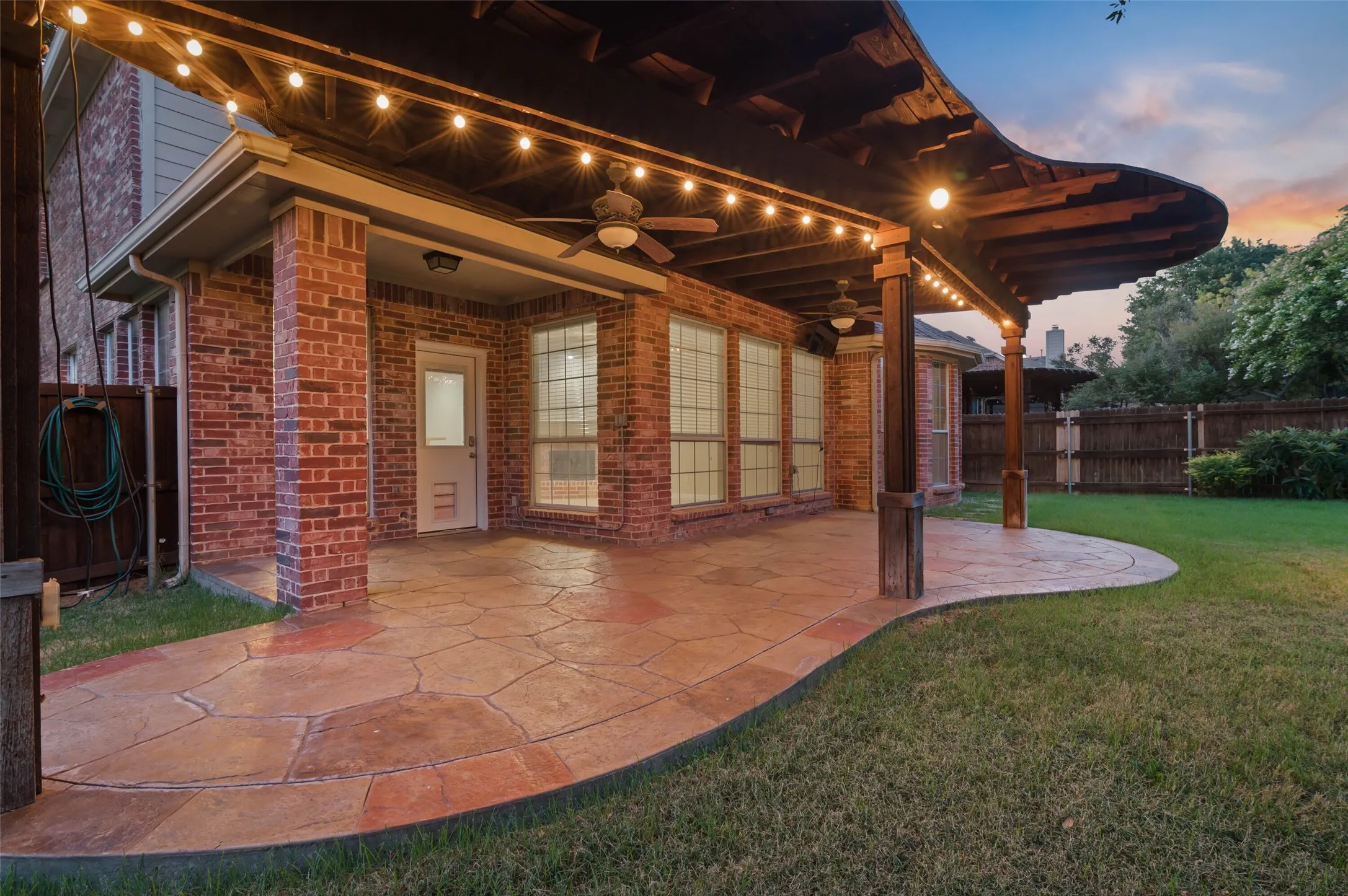 Patio is large enough for multiple sitting and dining areas.