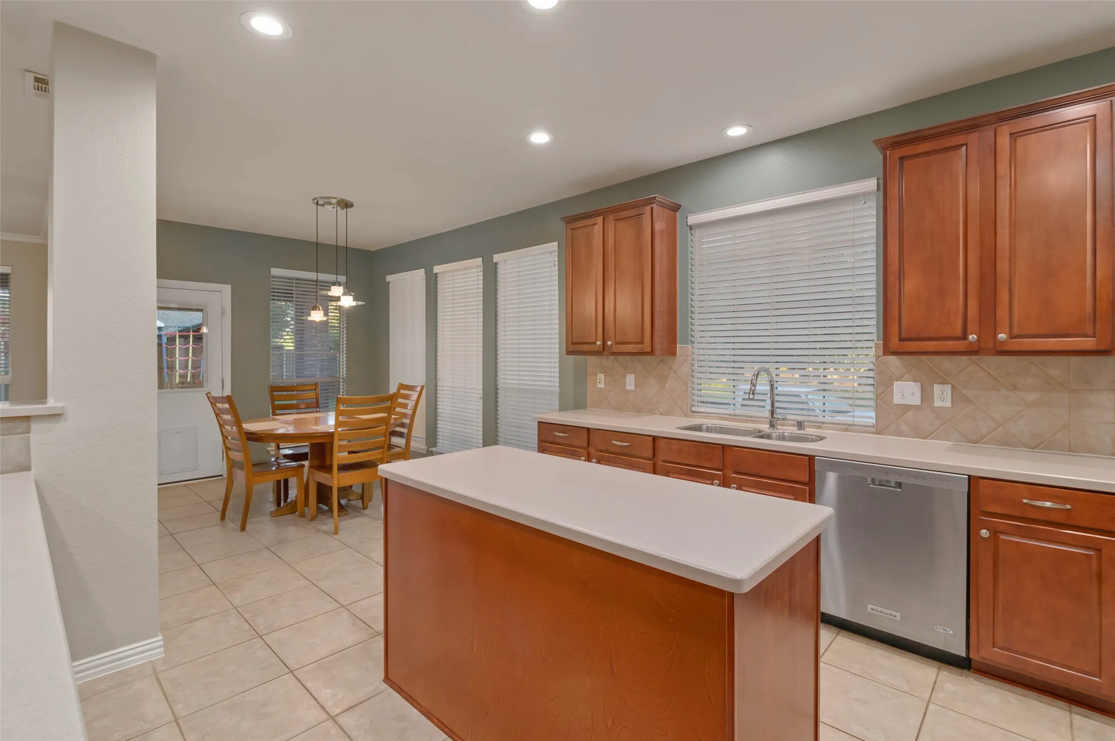 Kitchen with island, lots of cabinets and counter space and the breakfast area.