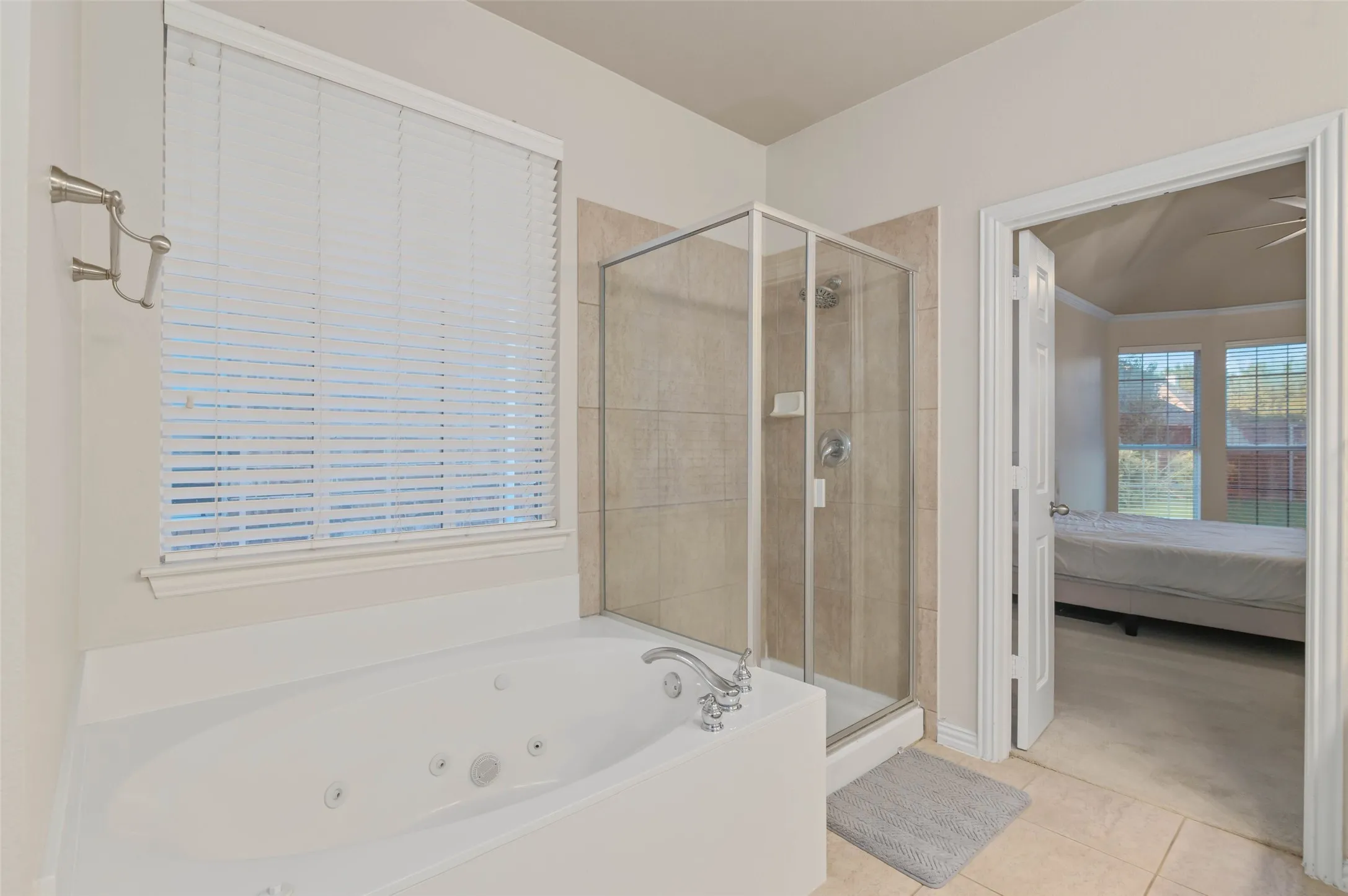 Large primary bathroom with separate tub and shower.