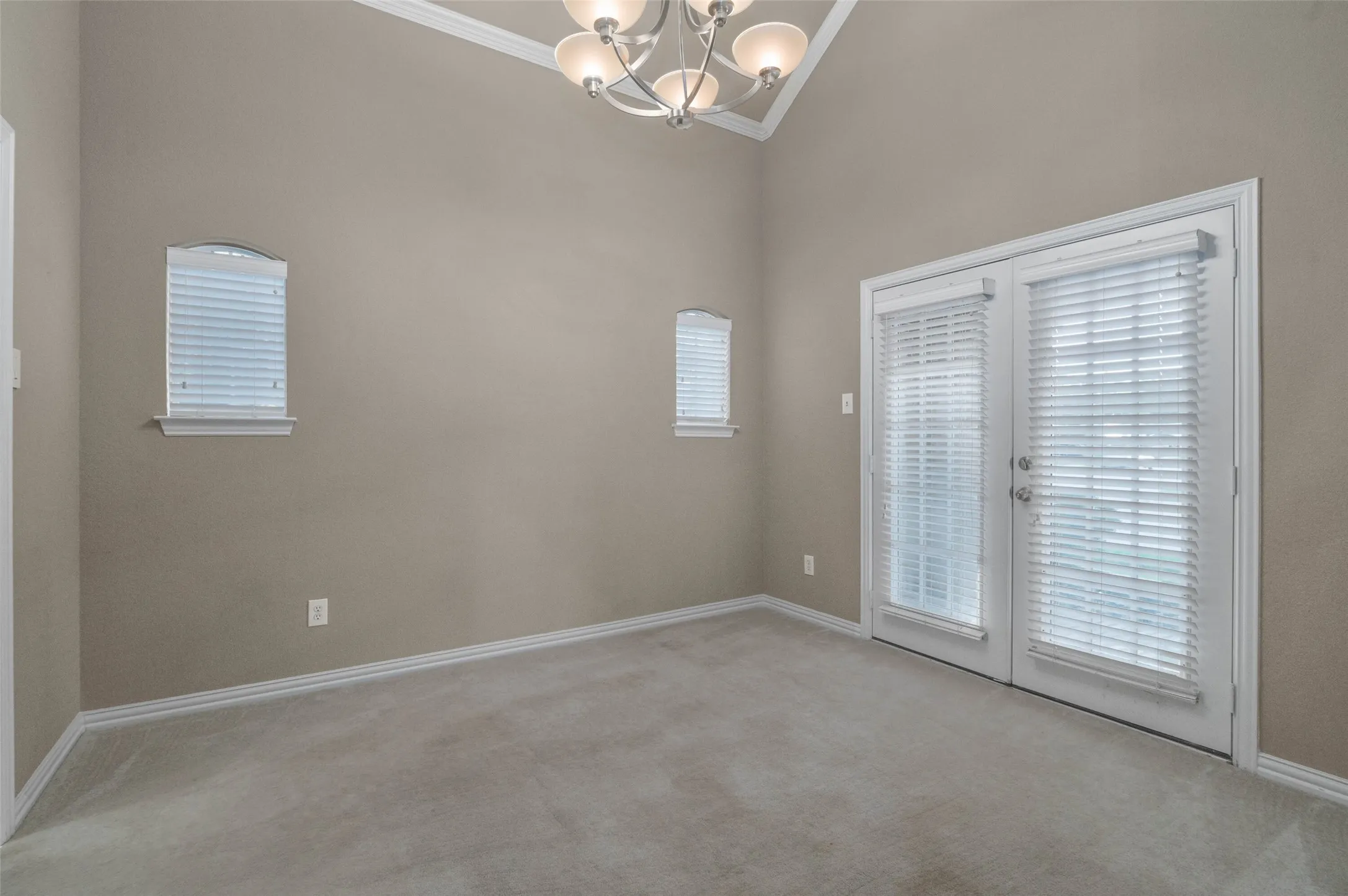 Dining room with French doors to the front covered patio.