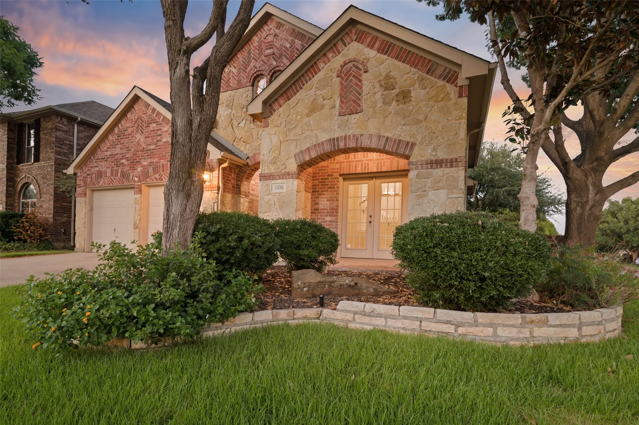 This home has a covered patio with French doors off the dining room.