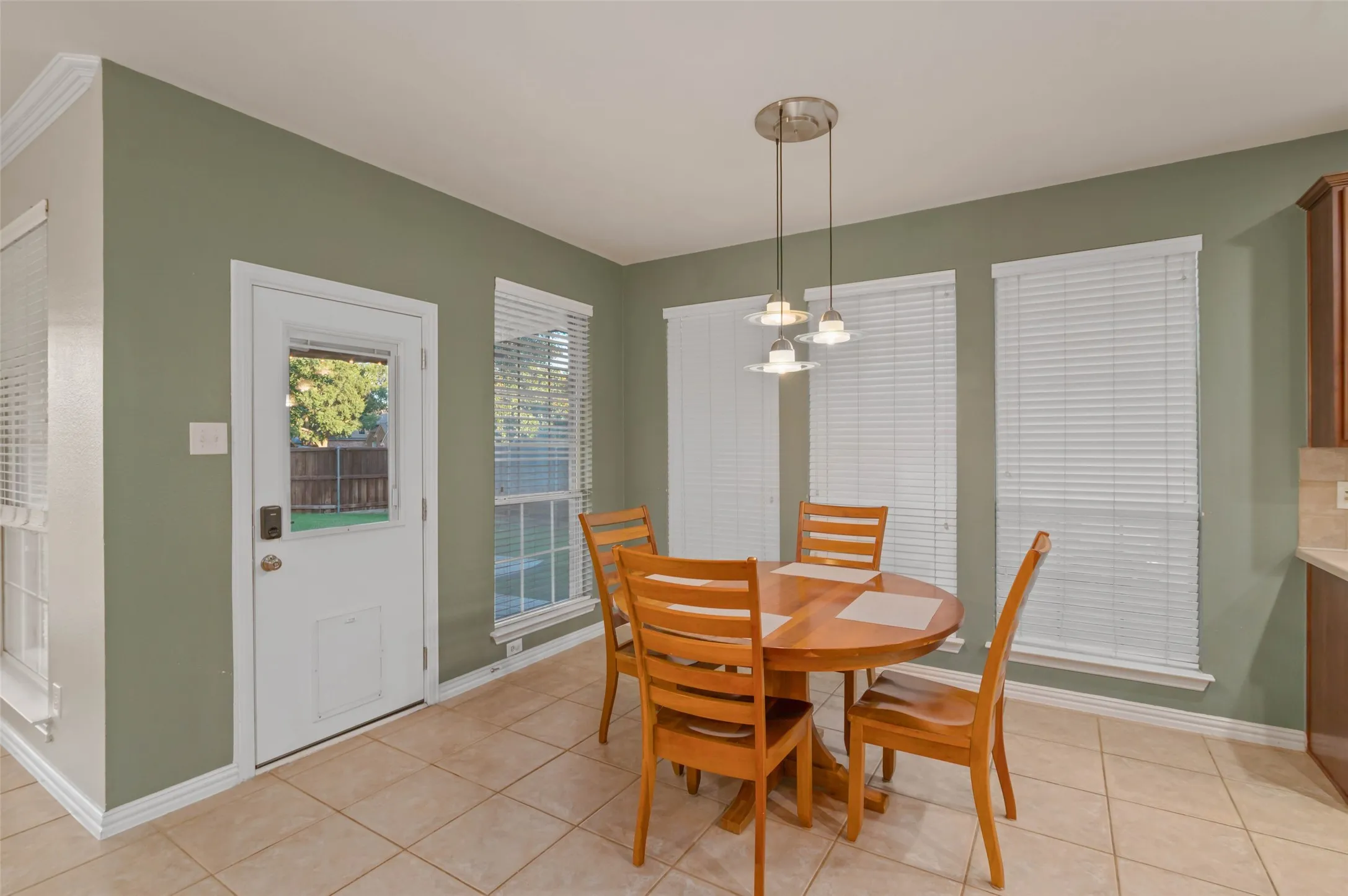 Breakfast area with access to the back covered patio.