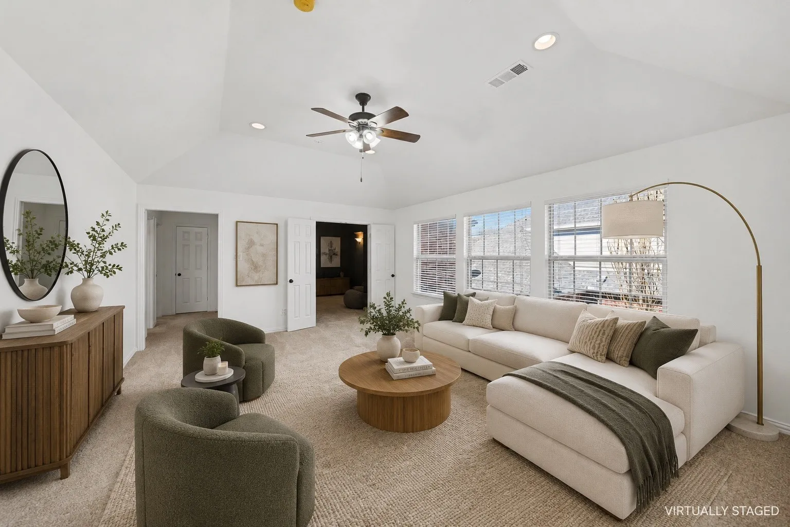 Vaulted ceilings feature a ceiling fan and recessed lighting