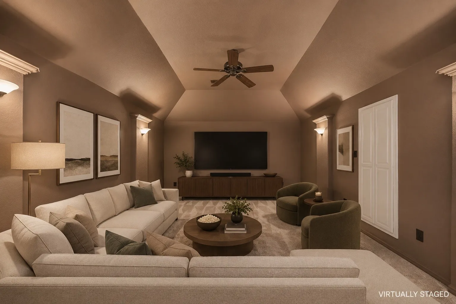 Vaulted ceiling room featuring a ceiling fan, wall sconces, and built-in white cabinetry