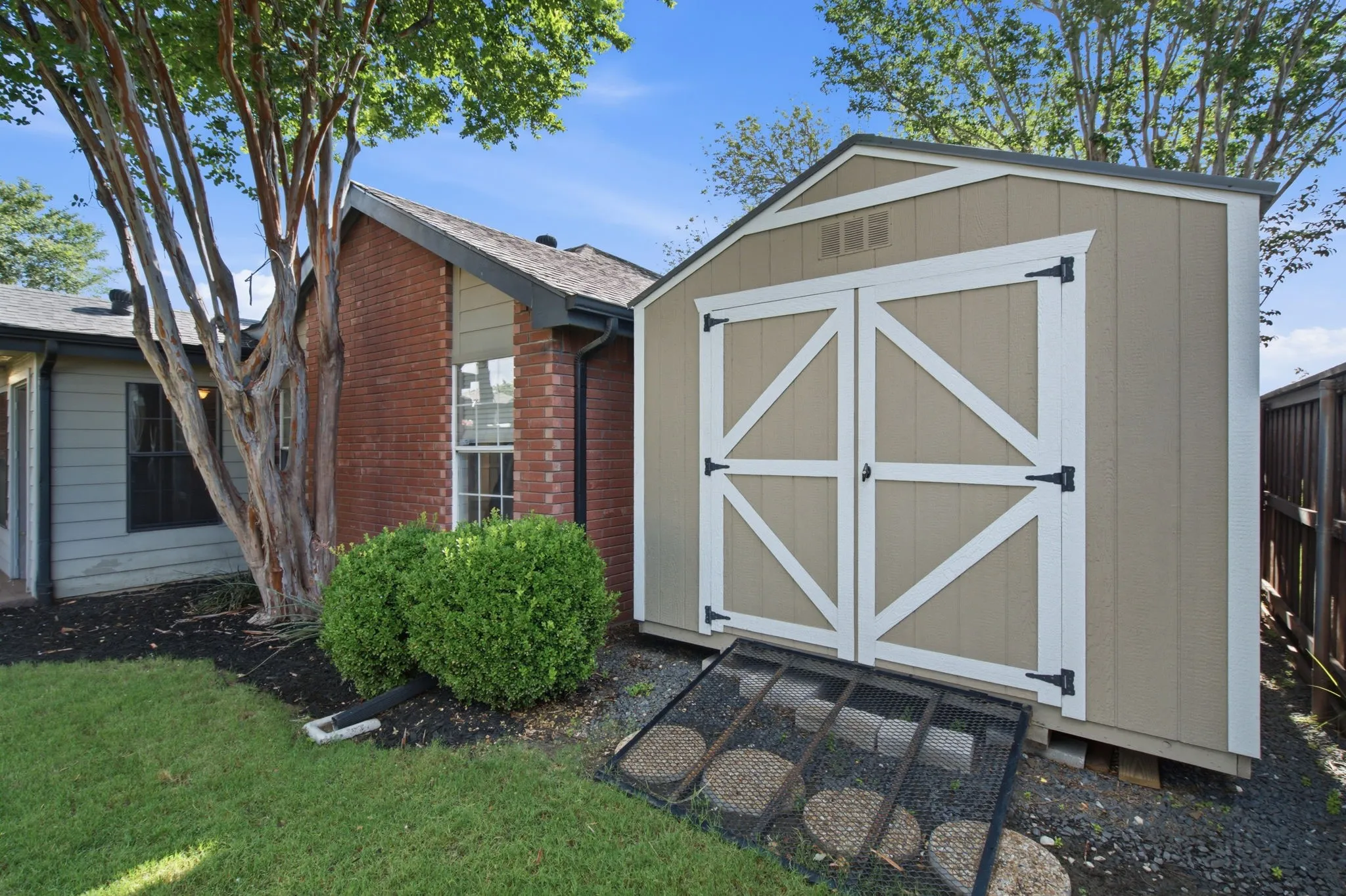 Freestanding storage shed with double barn doors
