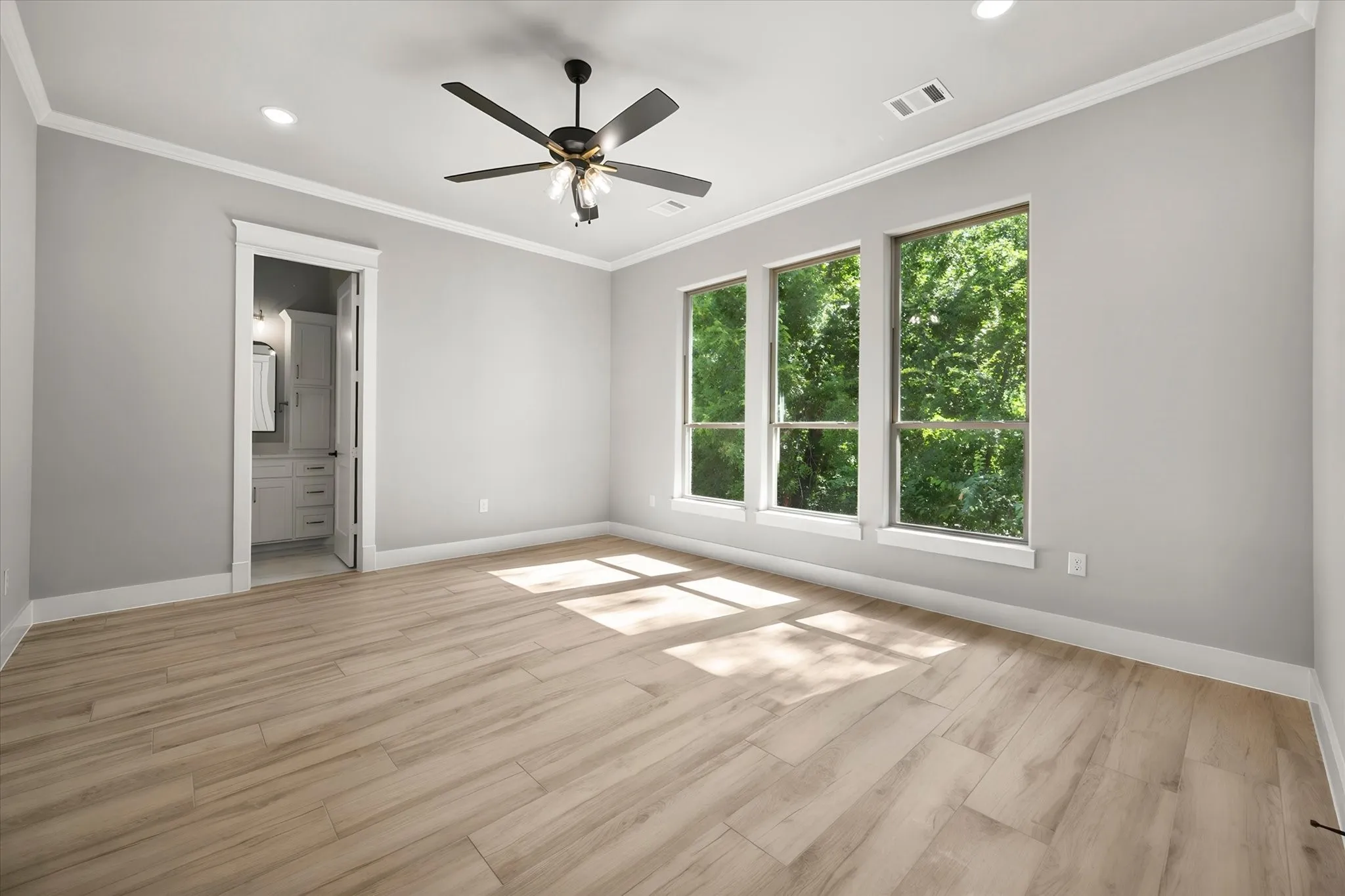 Wood-finish flooring, recessed lighting, and a ceiling fan with light fixture