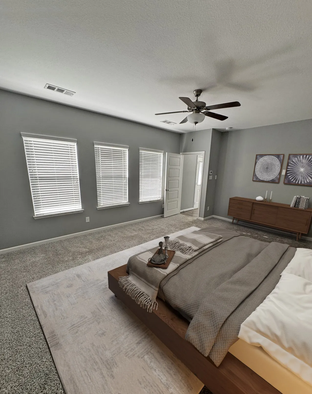 Carpeted flooring, multiple windows with blinds, ceiling fan with integrated lighting, paneled interior doors, and a neutral wall color