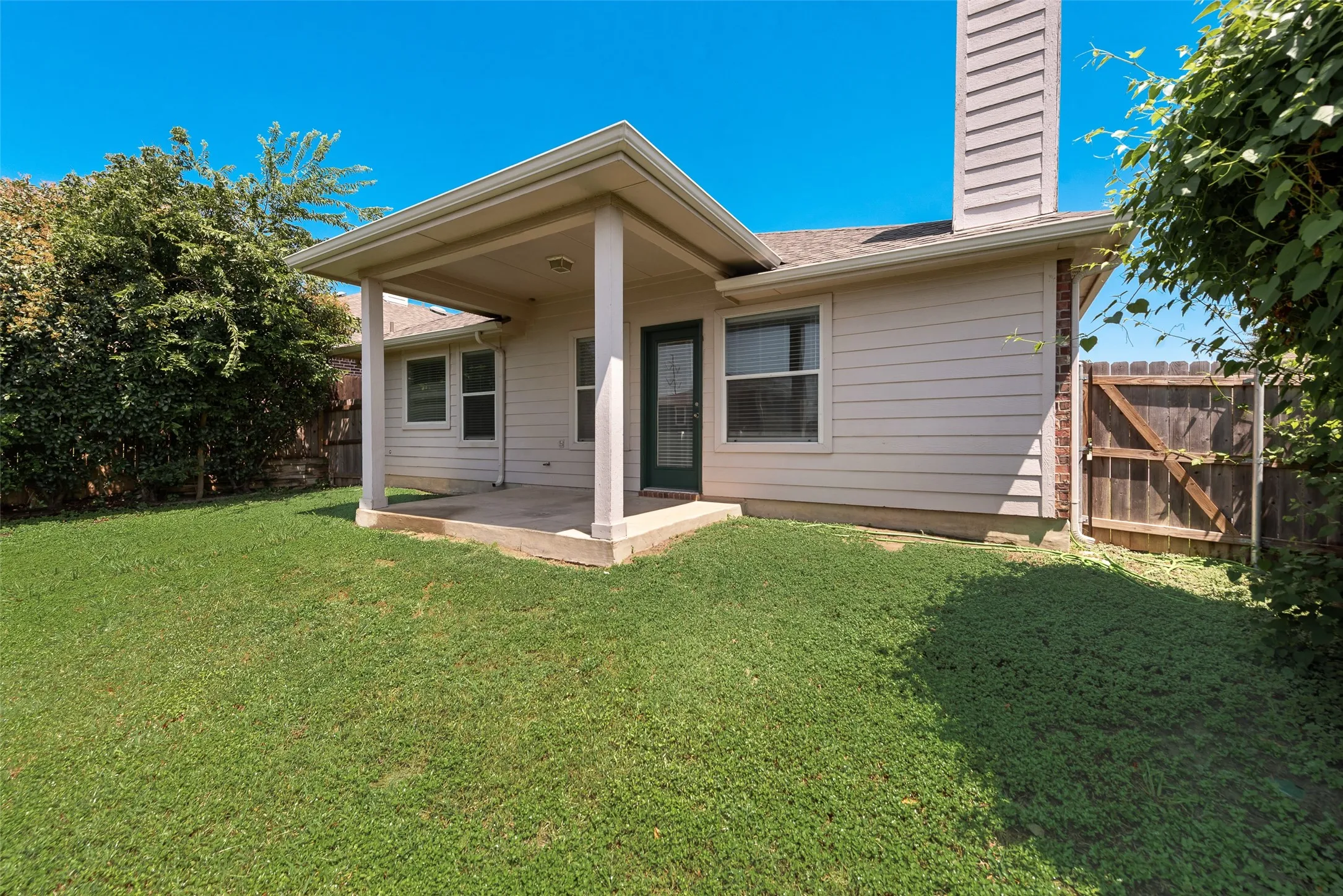 Backyard space with covered patio