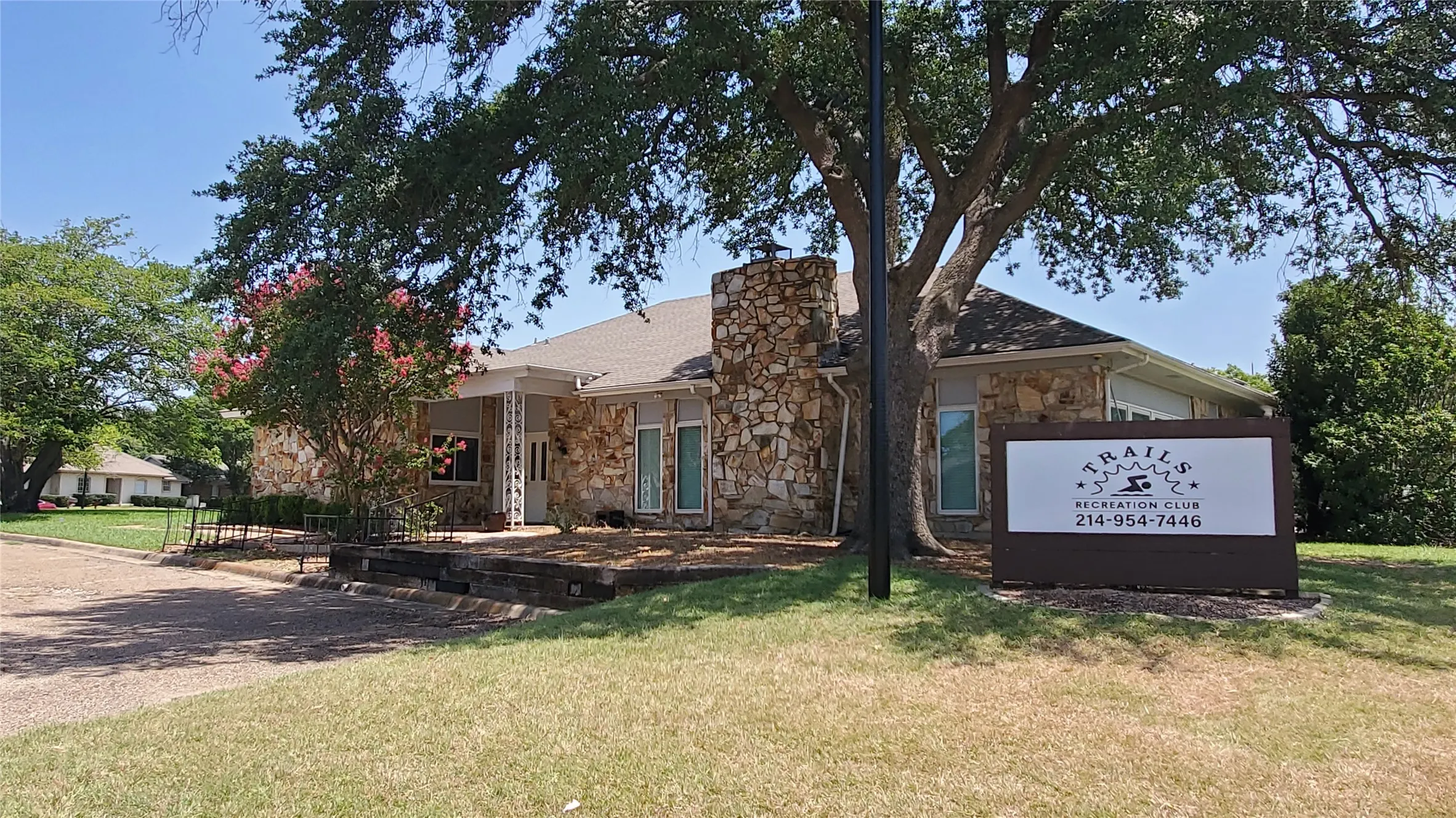 HOA amenity center with parking spaces.