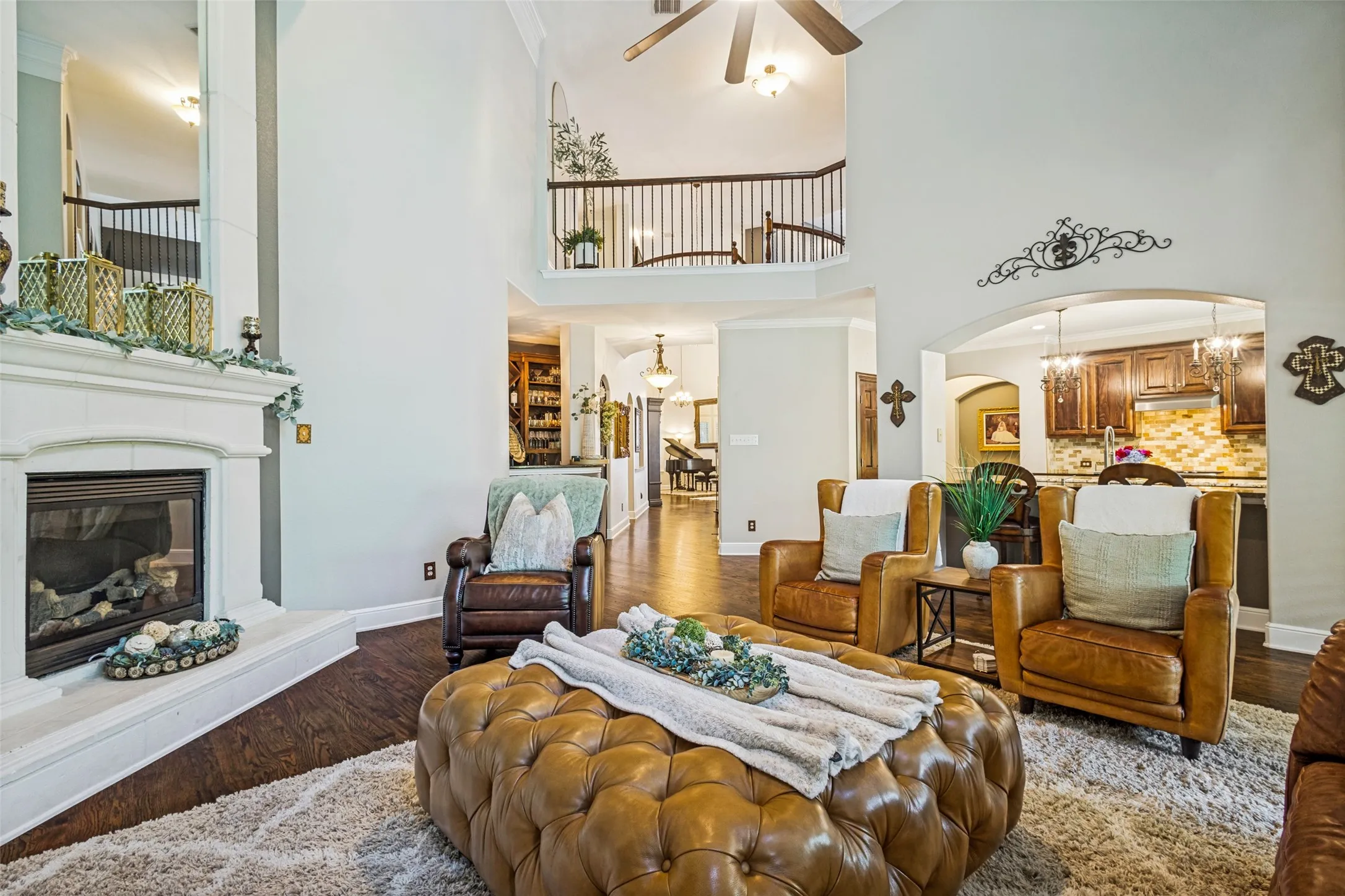 Downstairs view of family room, hallway and kitchen.