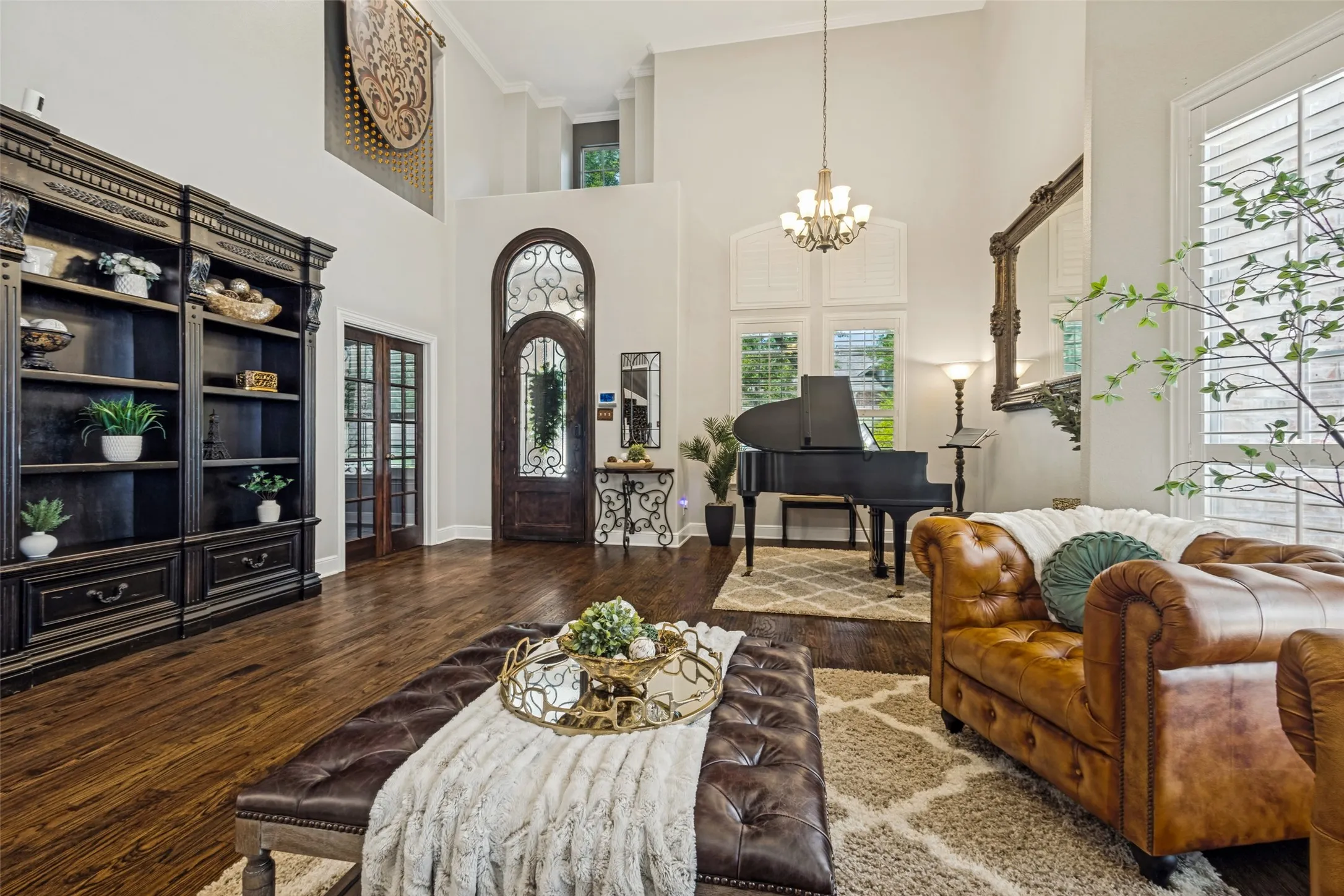 Formal living and dining areas showing double doors leading to the home office.