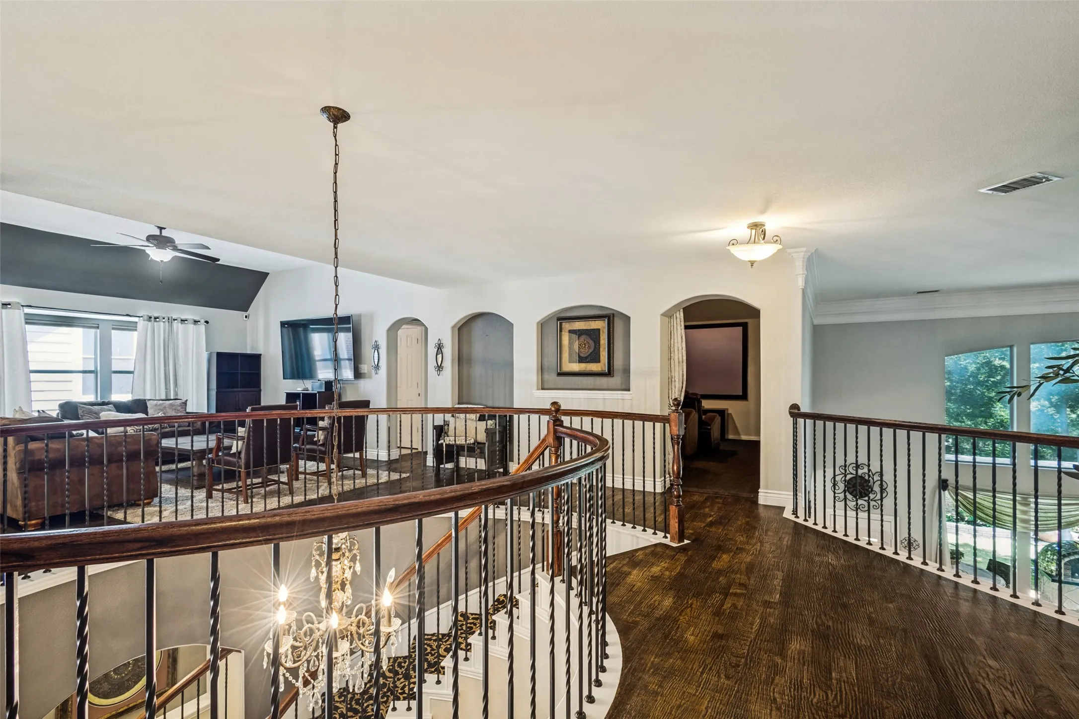 Upstairs hallway with view of media room and loft to the left.