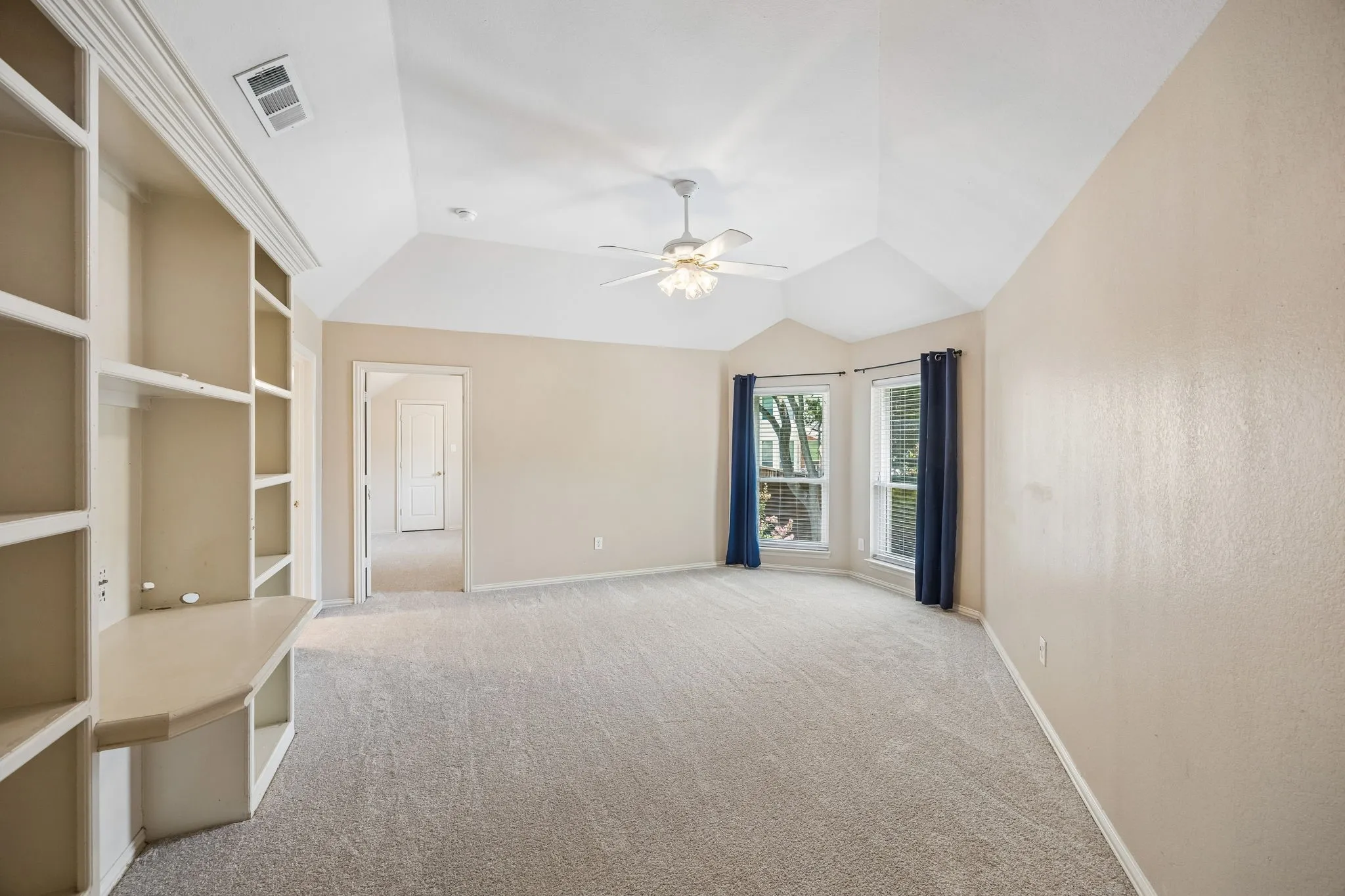 Step upstairs and find a good sized game room that could serve as a children's or teen retreat. The built in desk is perfect for homework and school projects. Find built in shelves as well as a game closet for storage as well as displaying books and projects. The secondary bedrooms are found off of this space.