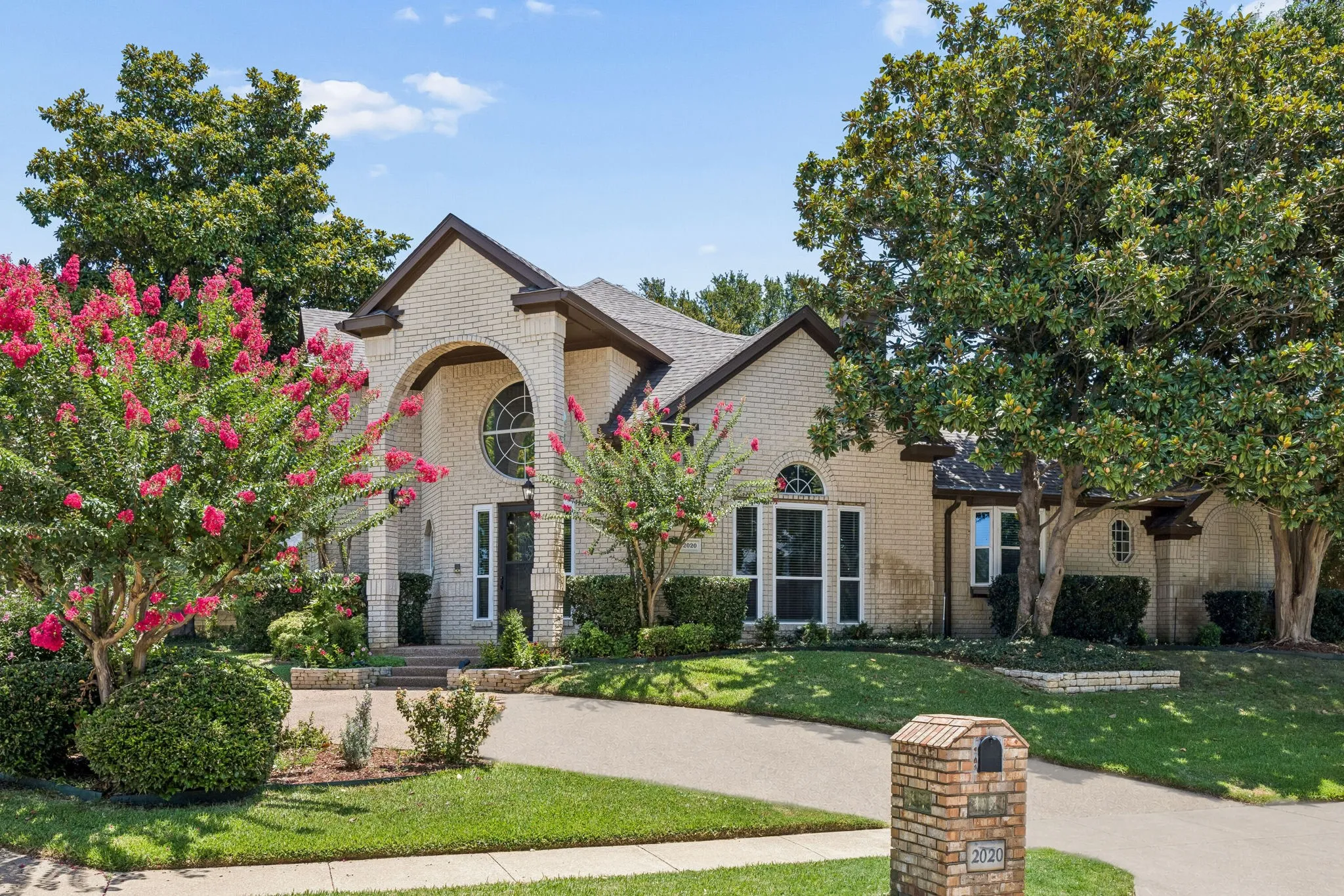 Welcome to 2020 Kipling Drive. Artistically situated on an oversized corner lot, the home offers a circle drive that can be accessed from both sides and lovely drive up appeal with mature trees and beautiful landscaping.
