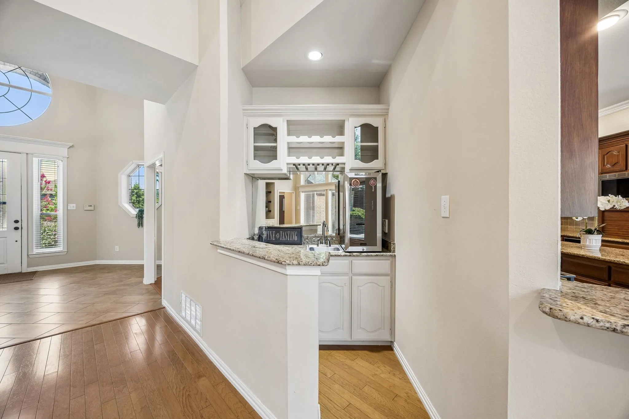 Great for entertaining, the wet bar area offers a sink, wine glass rack, glass fronted cabinets and locked storage​​‌​​​​‌​​‌‌​‌‌​​​‌‌​‌​‌​‌​​​‌​​ below.