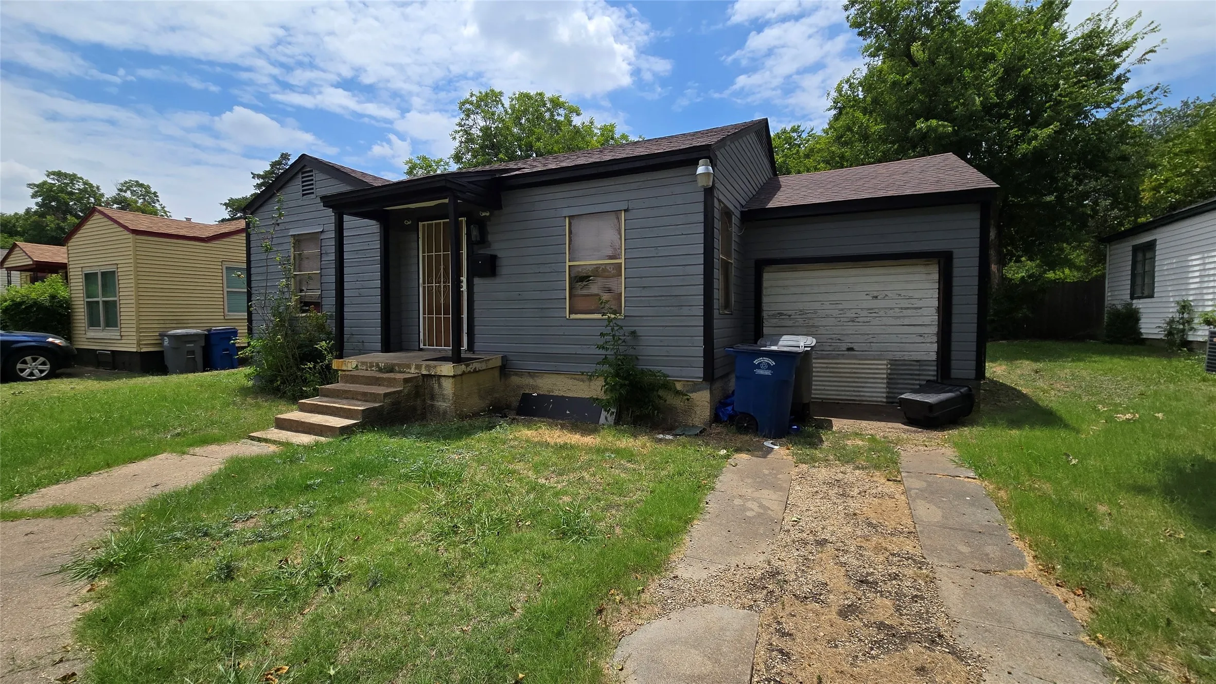 Exterior featuring horizontal siding, a covered front porch, a single-car garage, a concrete driveway, and a front walkway