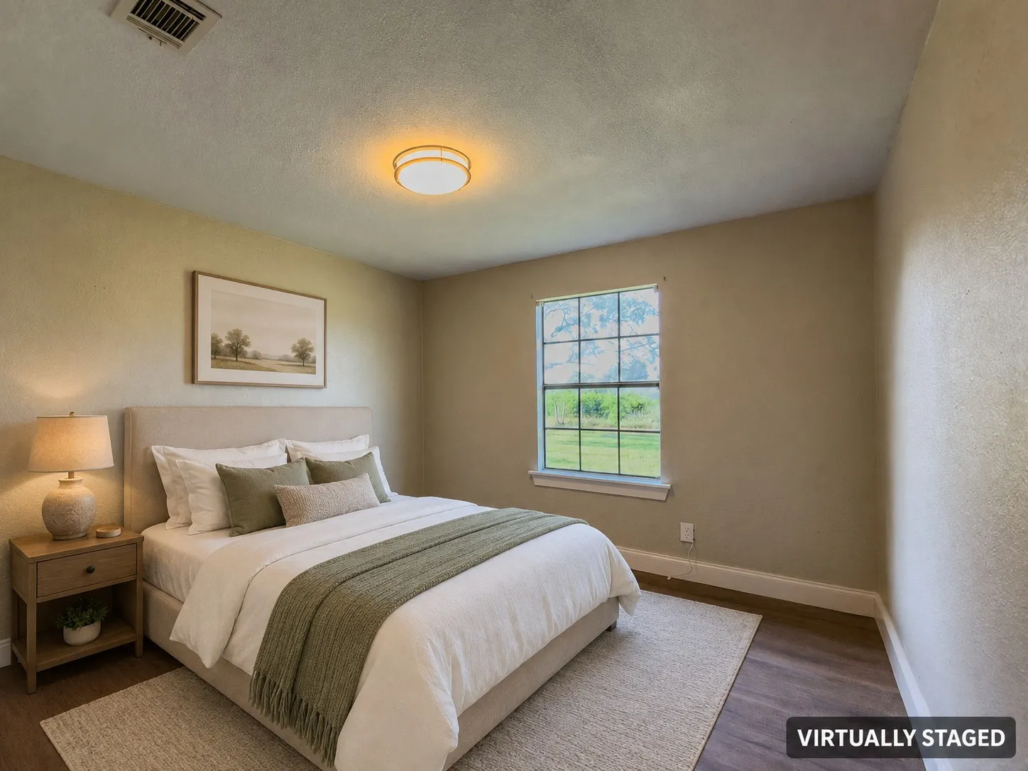 Neutral-toned interior with wood-finish flooring, a contemporary ceiling light fixture, a window featuring exterior landscaping, and white baseboards