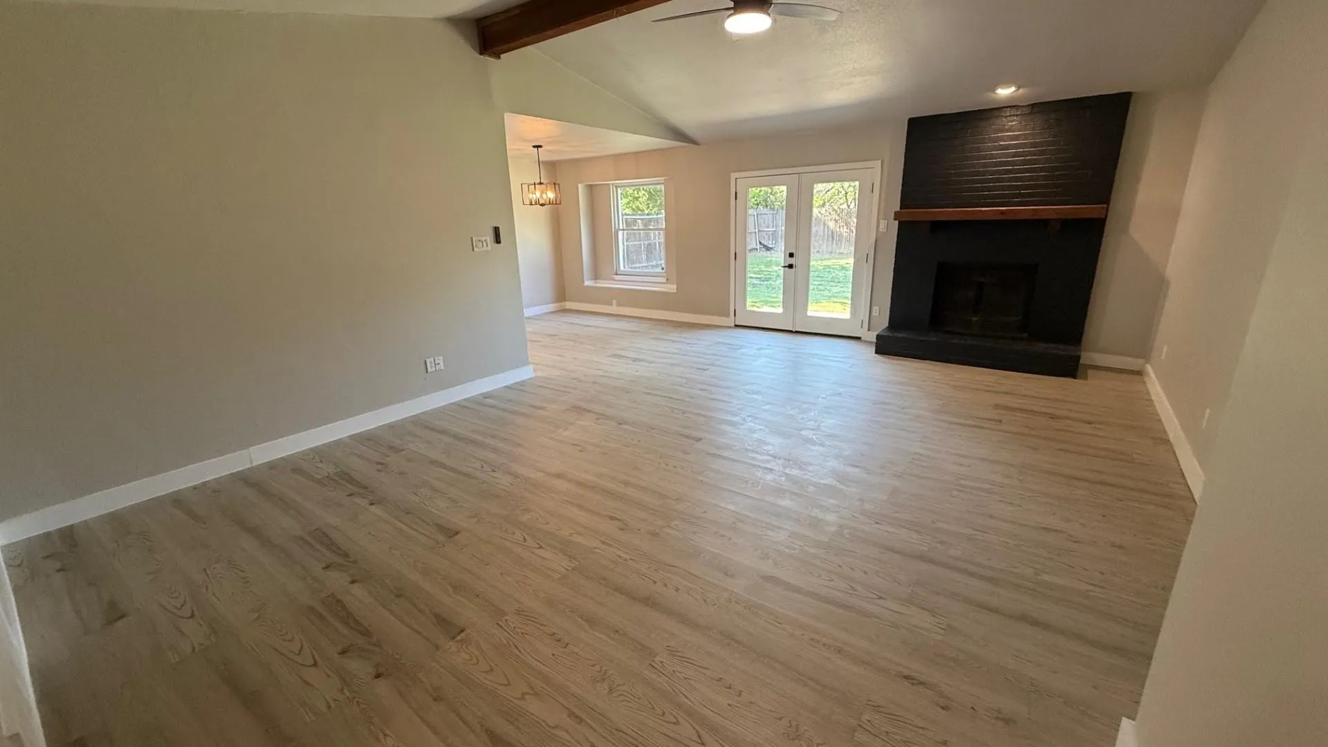 Living Room w/Fireplace and French doors to backyard
