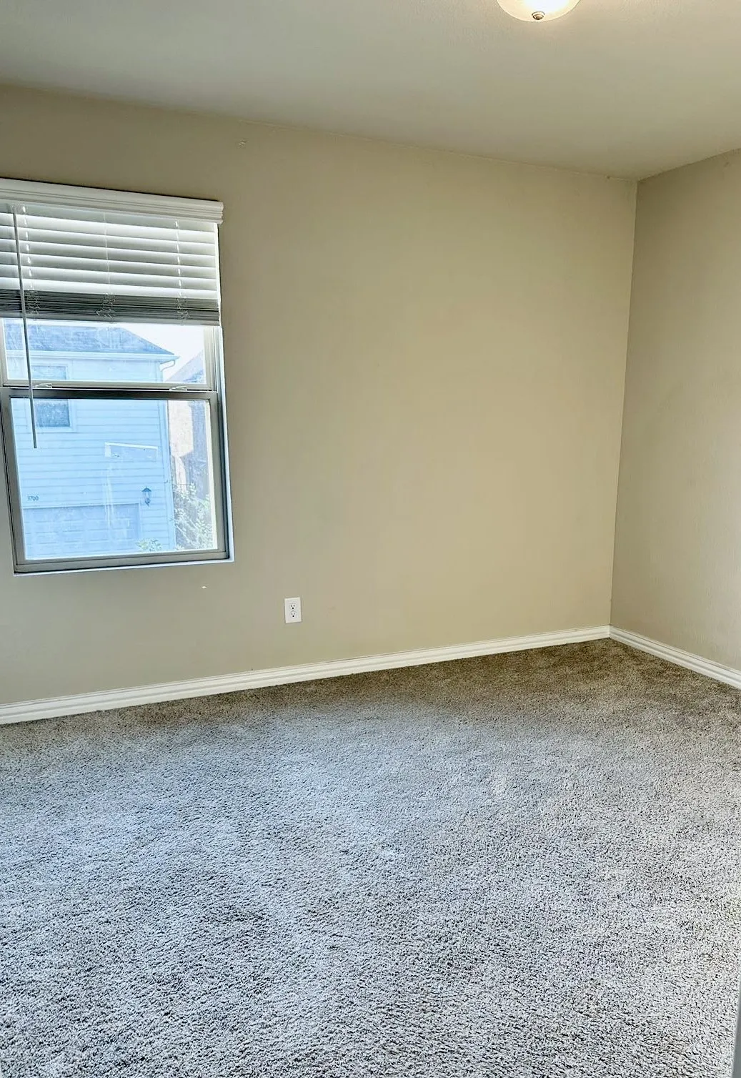 Empty room with carpet floors