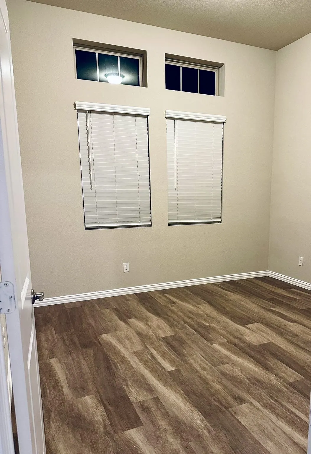 Spare room featuring dark hardwood / wood-style flooring