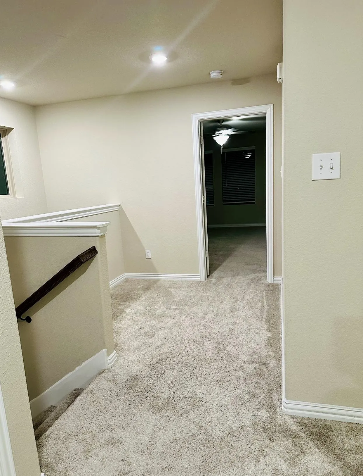 Corridor featuring carpet