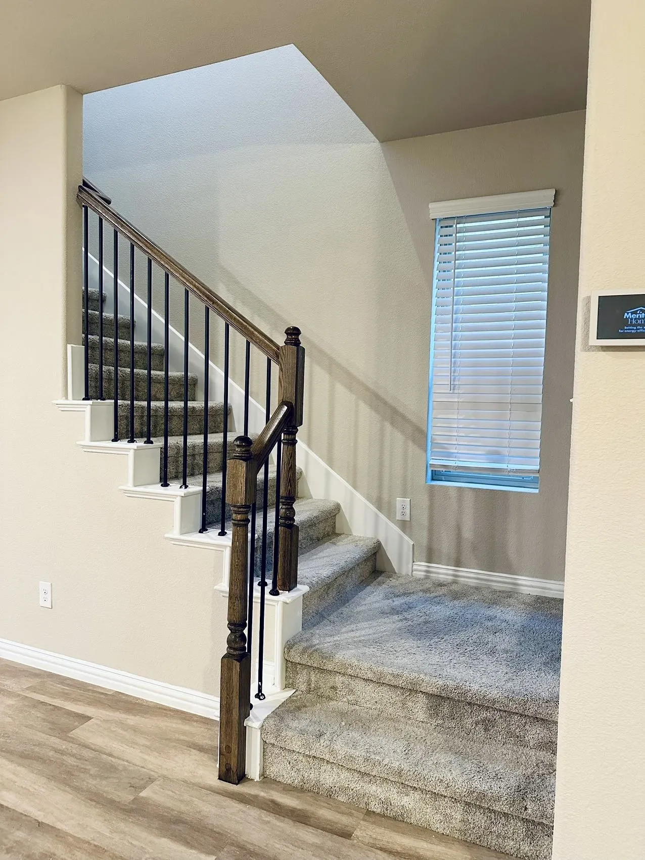 Stairway with hardwood / wood-style flooring