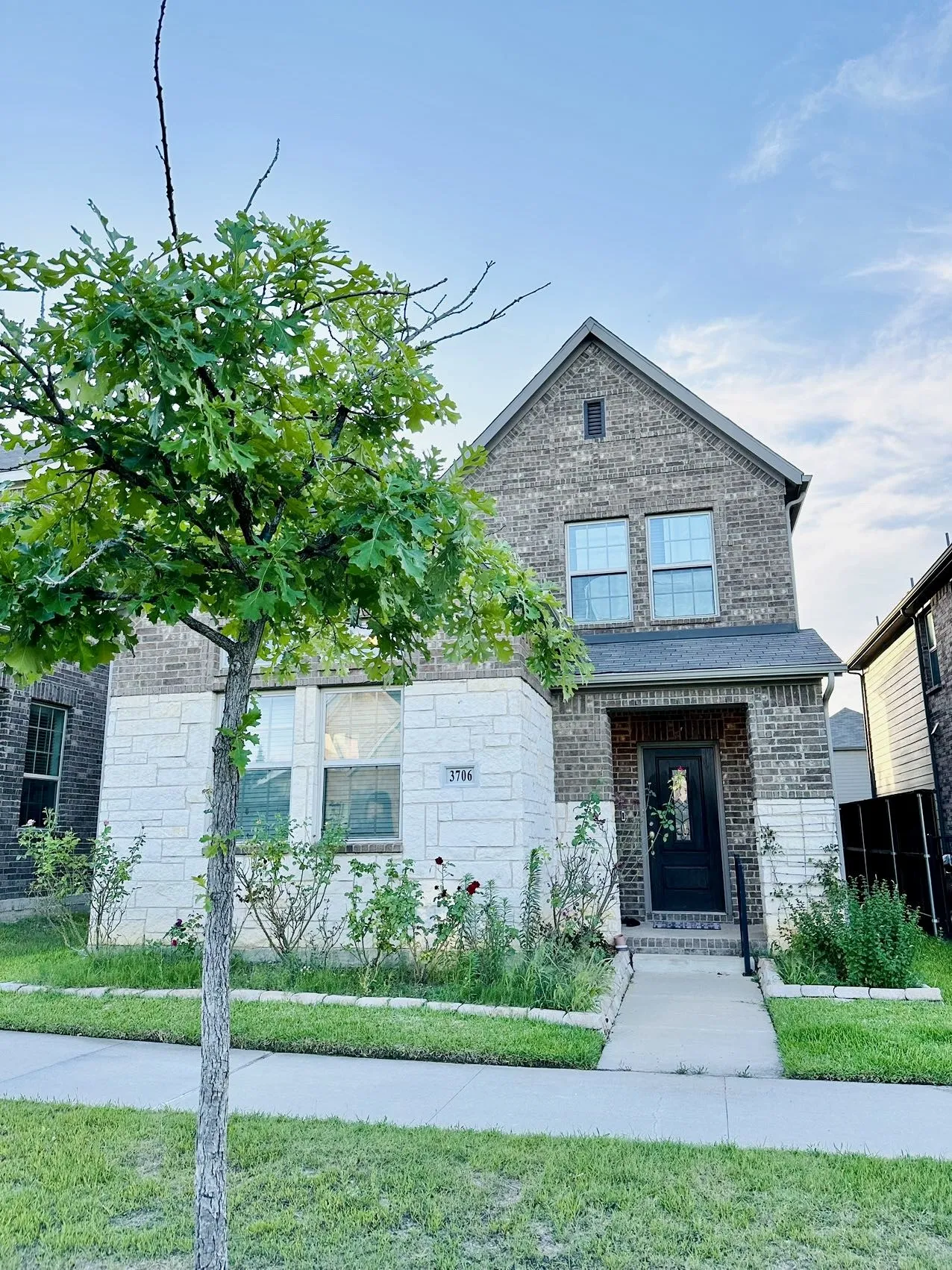 View of front of property with a front lawn