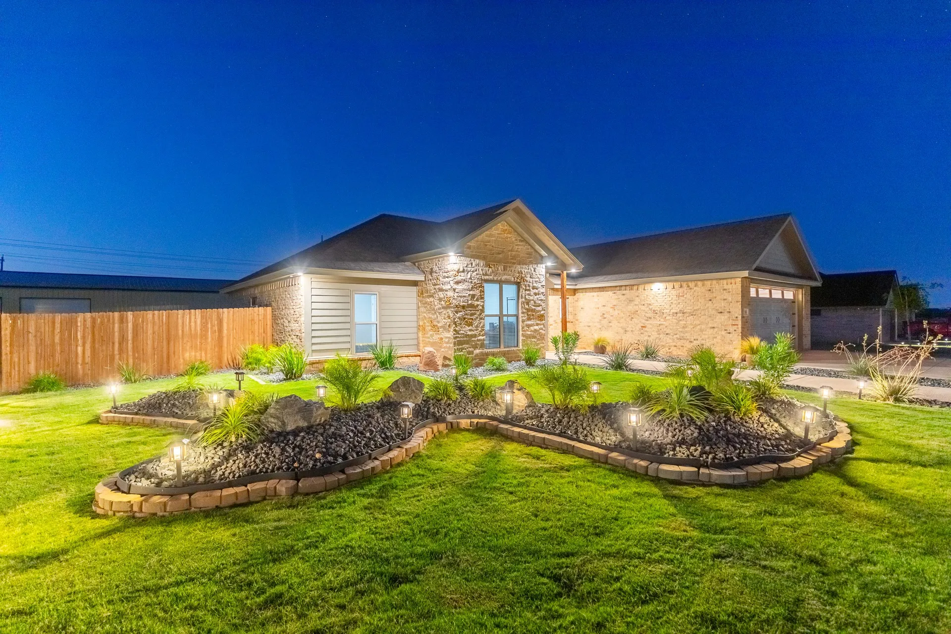 Contemporary facade featuring stone and brick accents