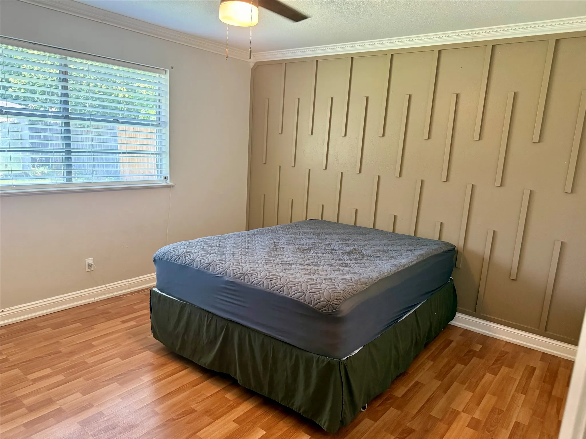 Accent wall featuring a modern vertical slat design