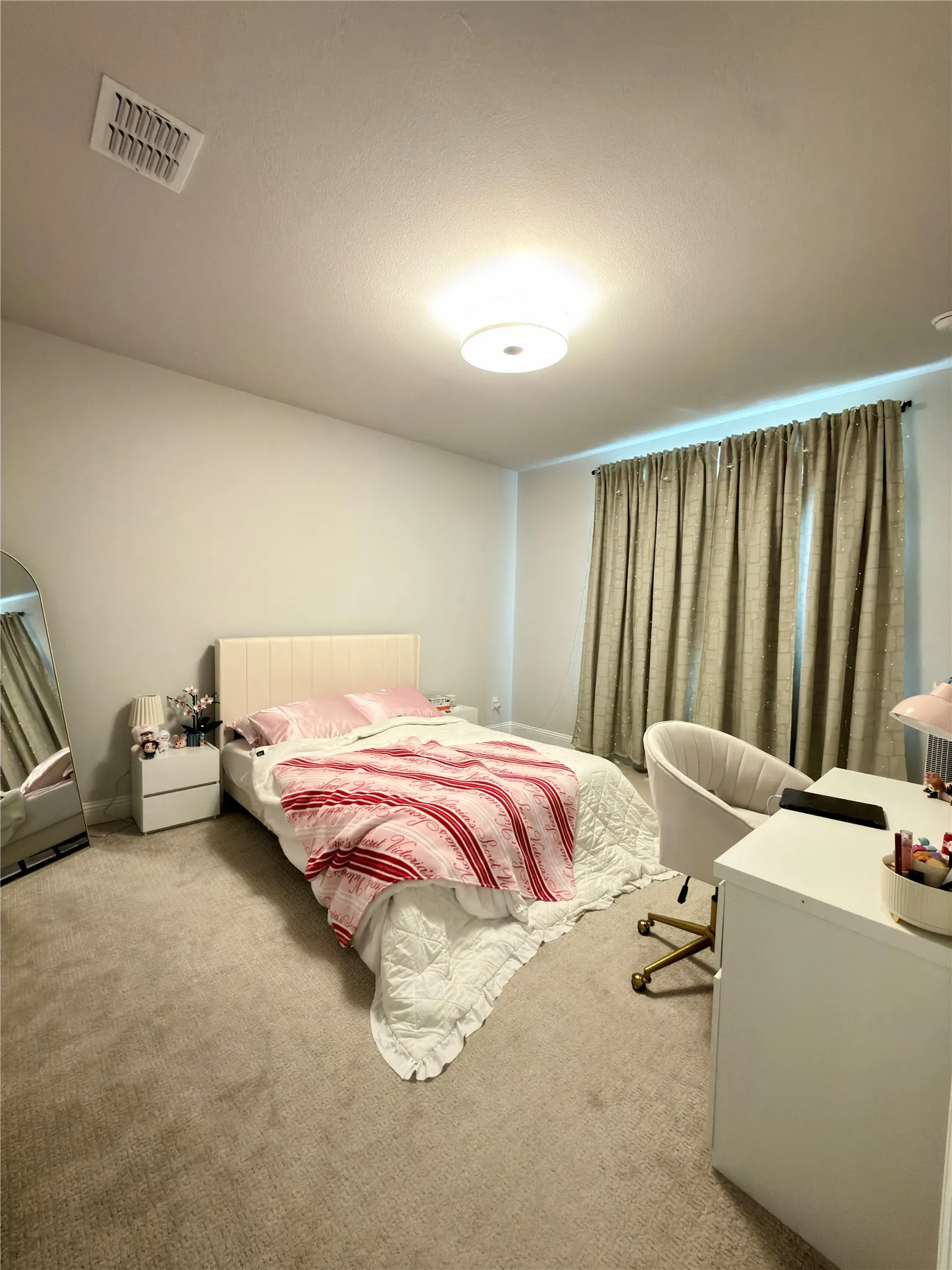 Plush carpeting complementing neutral wall tones