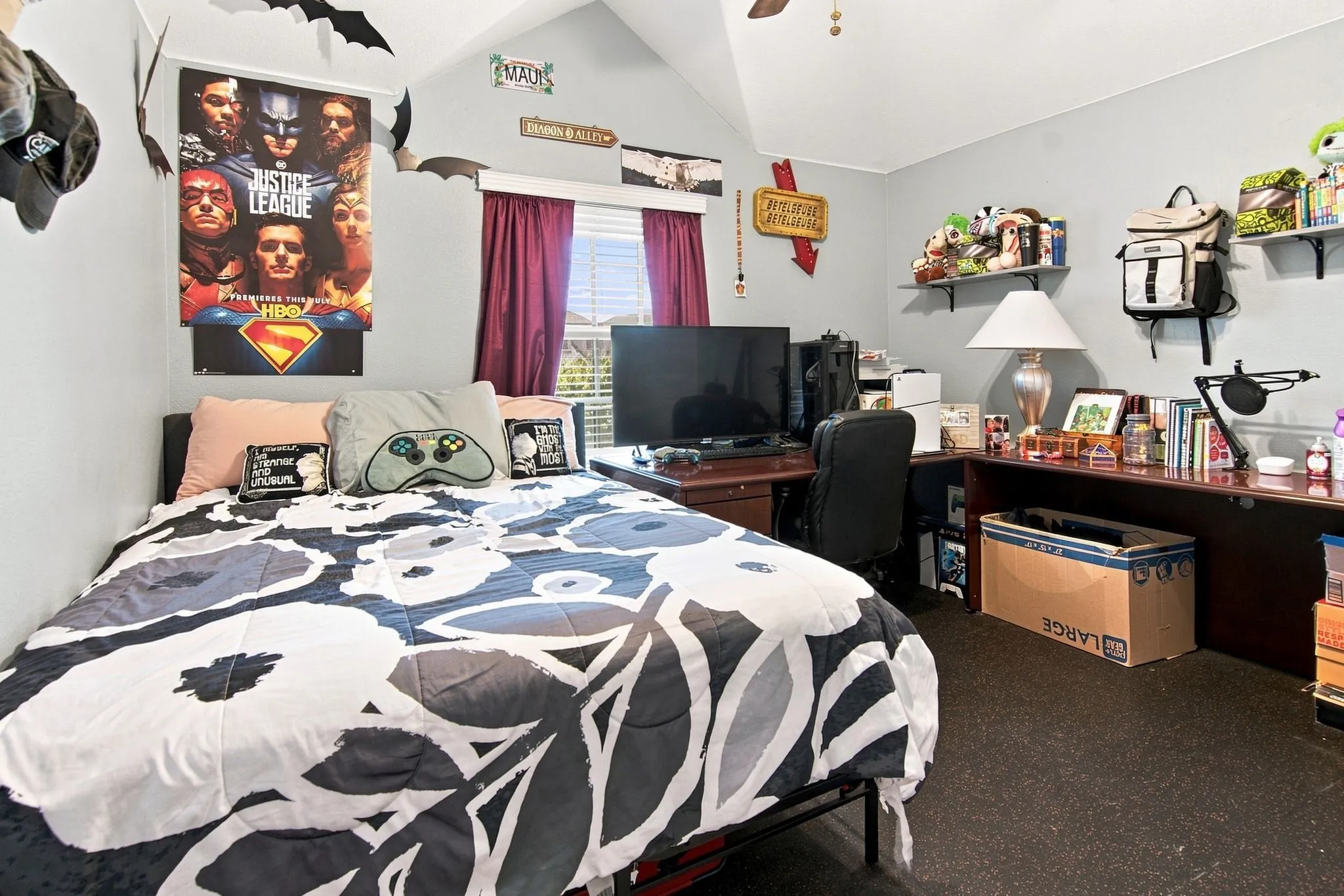 Interior room featuring light gray walls and dark flooring