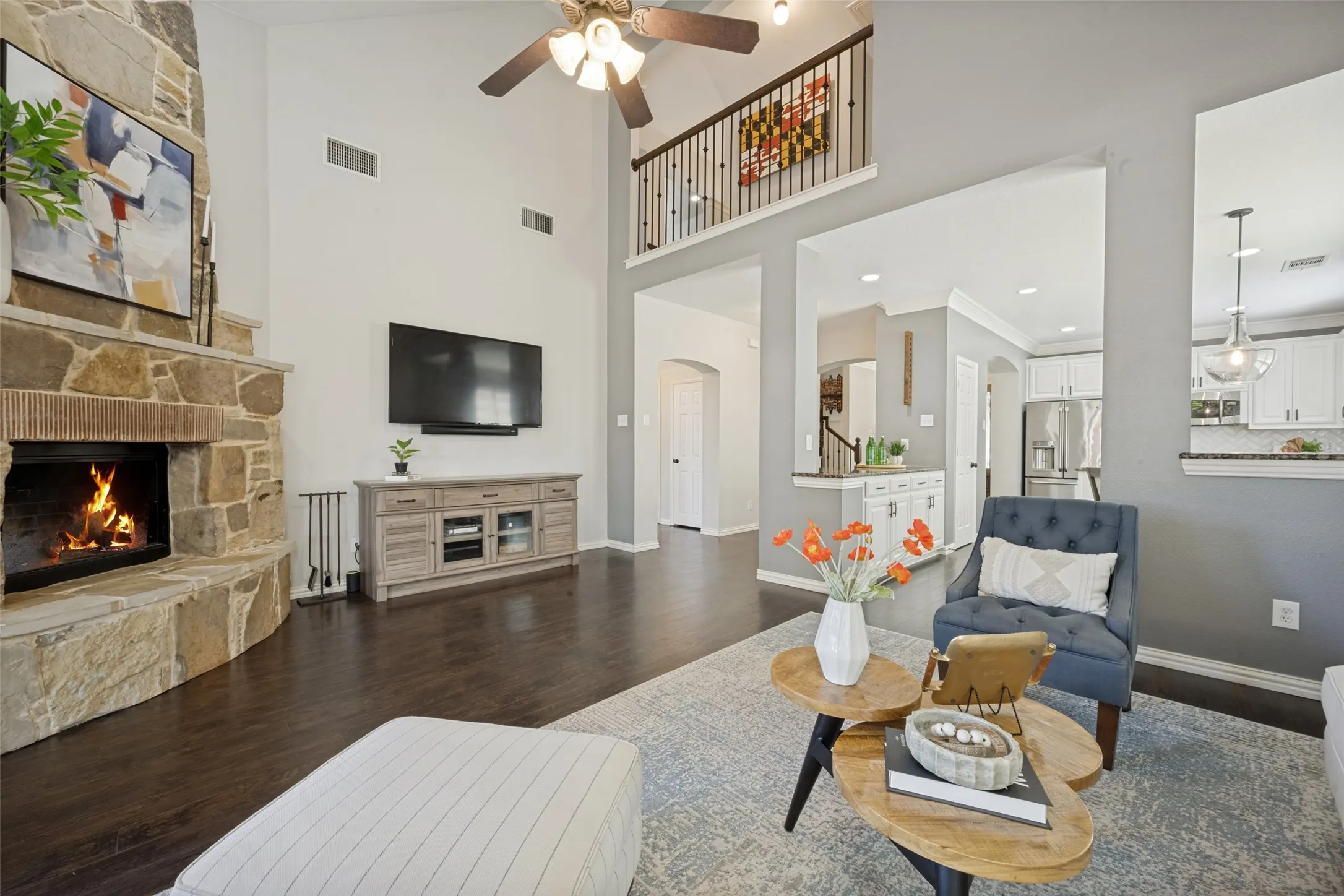 Updated with beautiful wood flooring, paint, fans, open view to second floor catwalk.