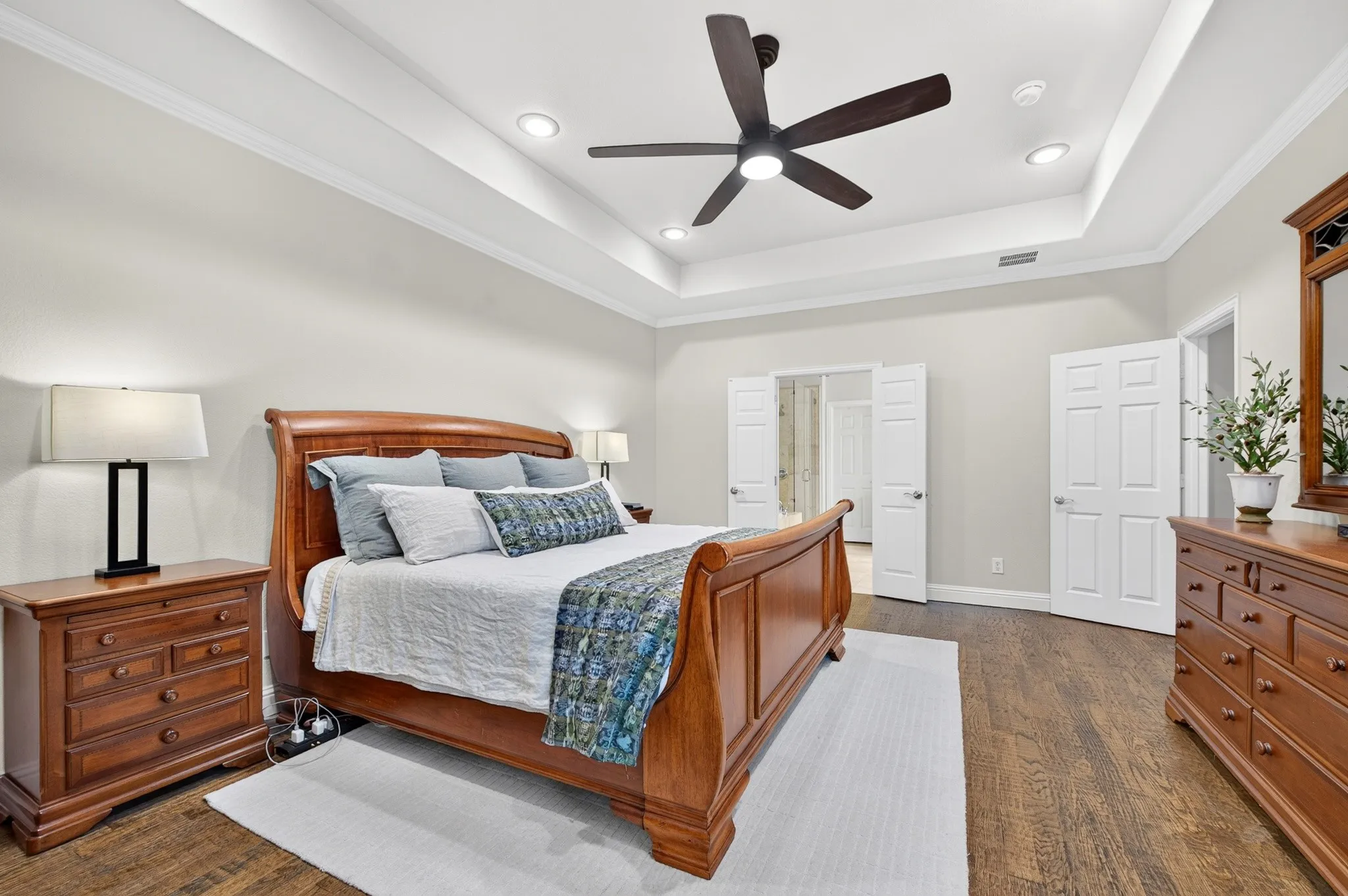 The hand scraped wood floors add so much to this home and bedroom!