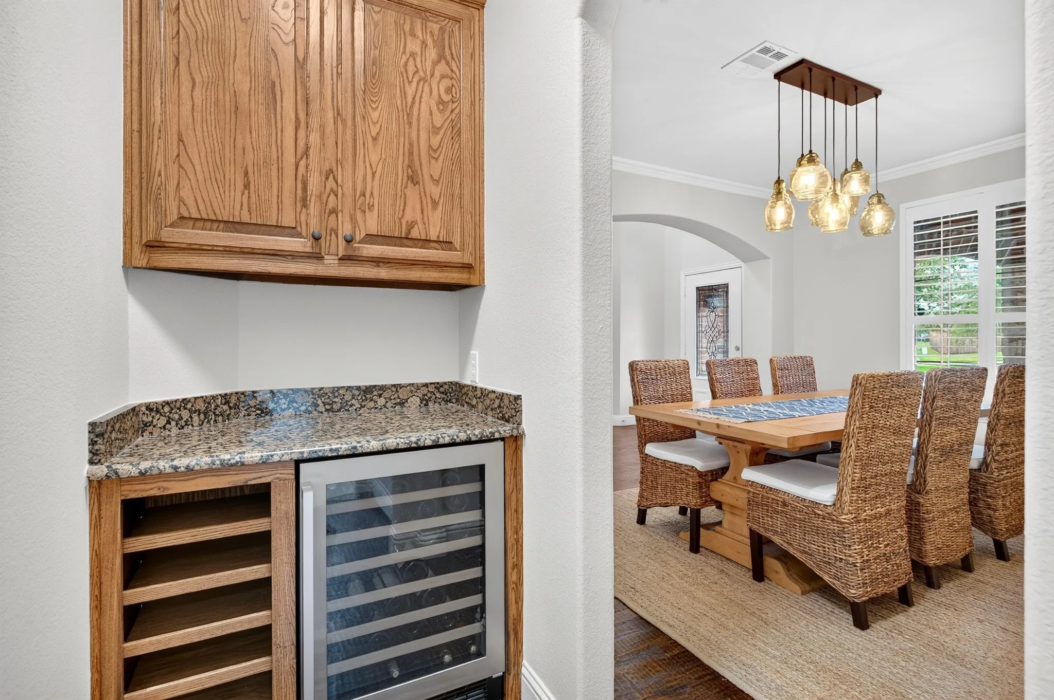 Cute Butler's pantry with beverage fridge.