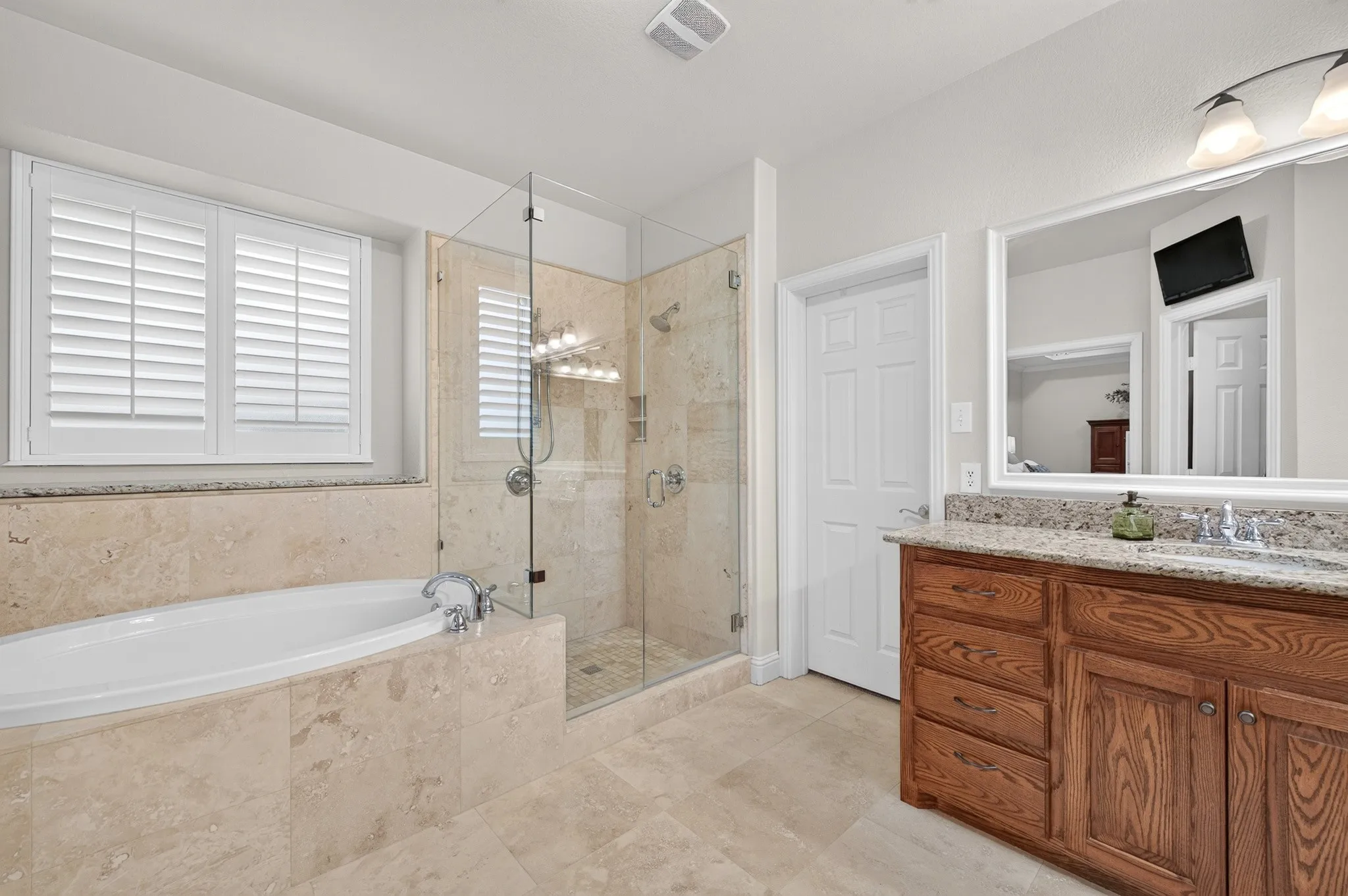 Large primary bath with garden tub and lovely frameless shower!
