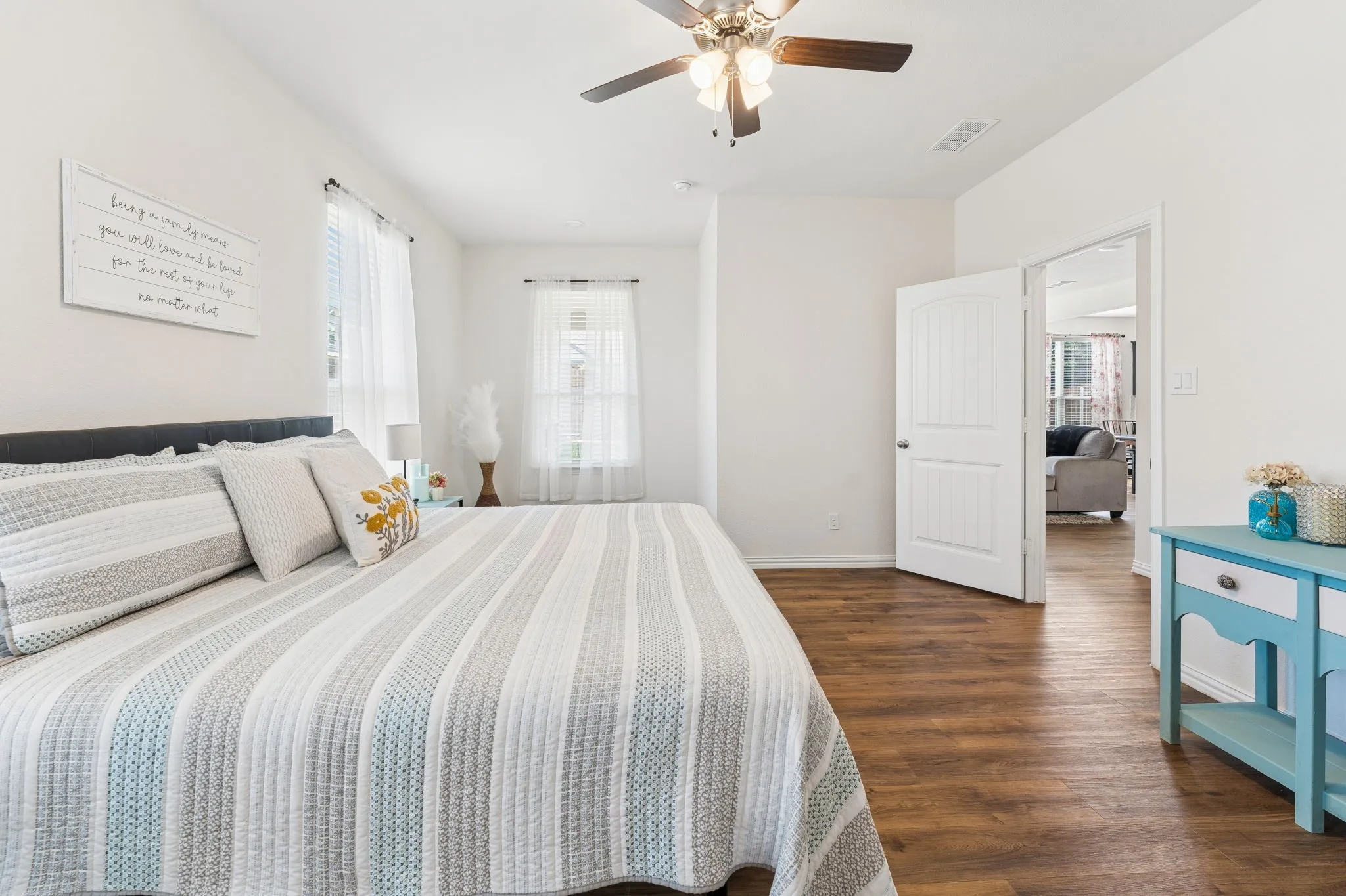 Primary bedroom with sitting area.