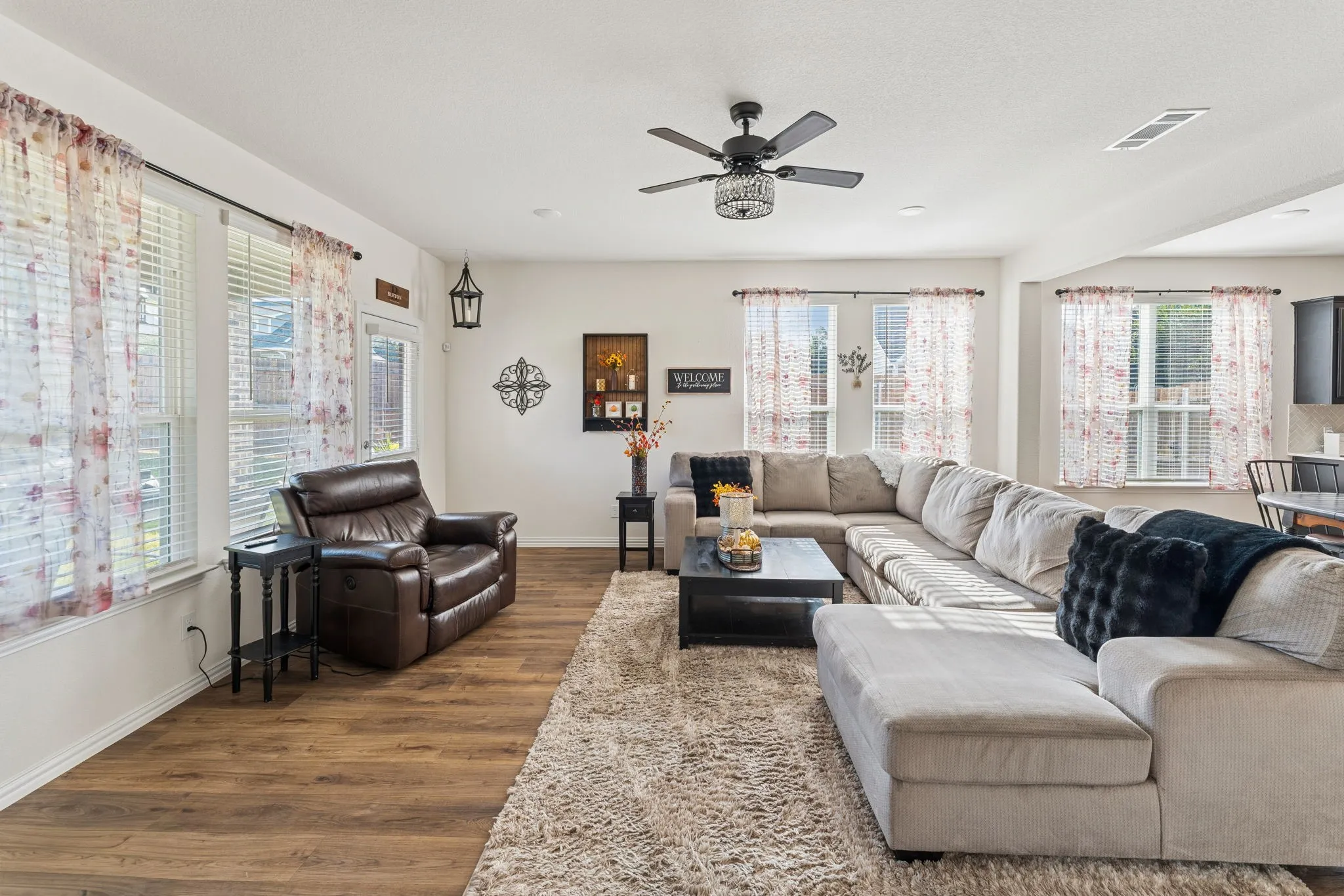 Large living area with LVP flooring.