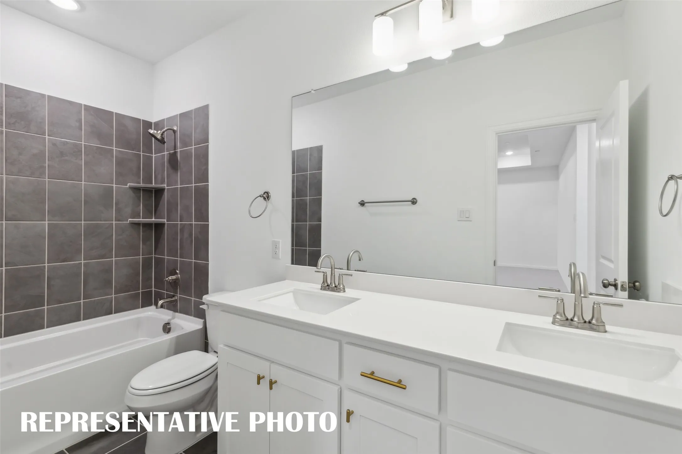 Friends and family will appreciate having their own vanity space in this thoughtfully designed guest bath.