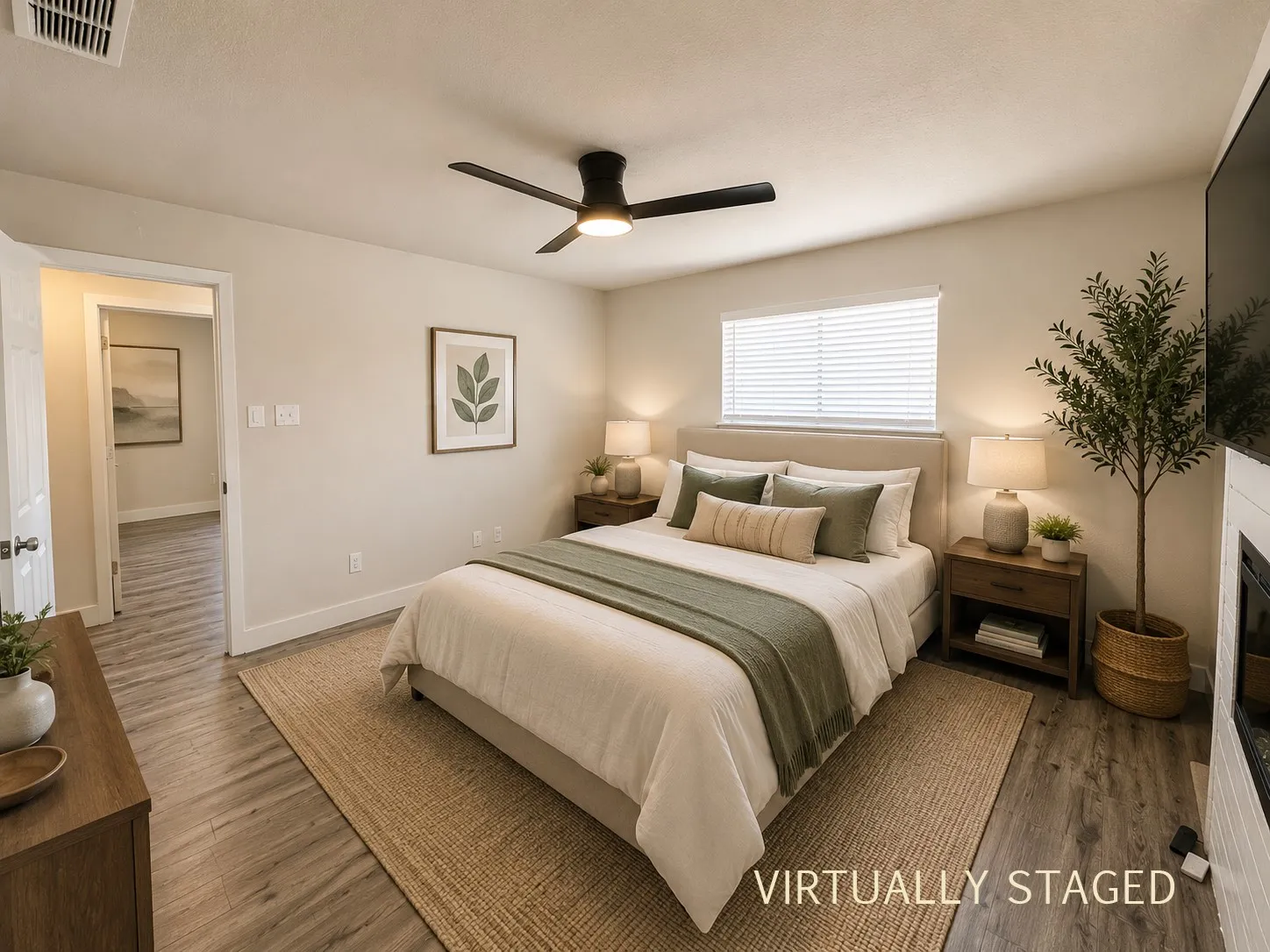 Bedroom featuring wood-finish flooring, a ceiling fan with integrated lighting, and a window with blinds