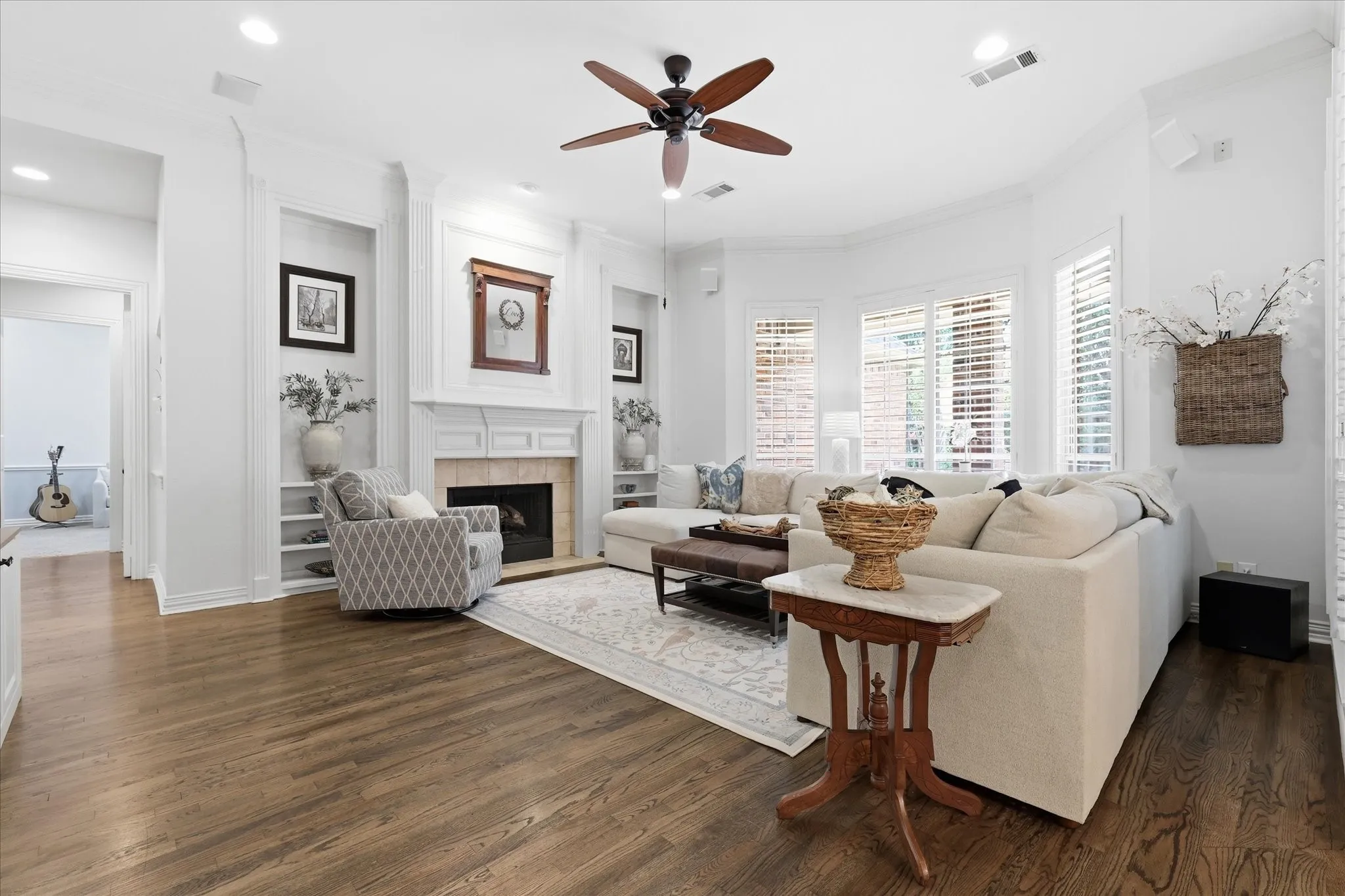 Open light & bright living Room with bay window, WBFP & built-ins.