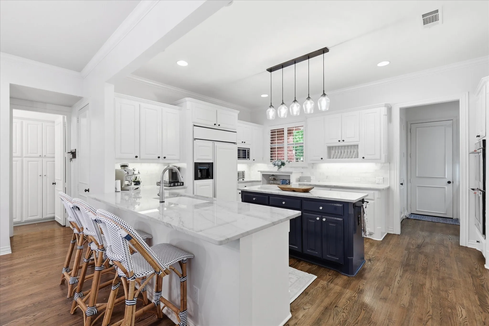 Open to the liv & brk areas is this gourmet kitchen with Quartzite tops & built-in Frig-Freezer.