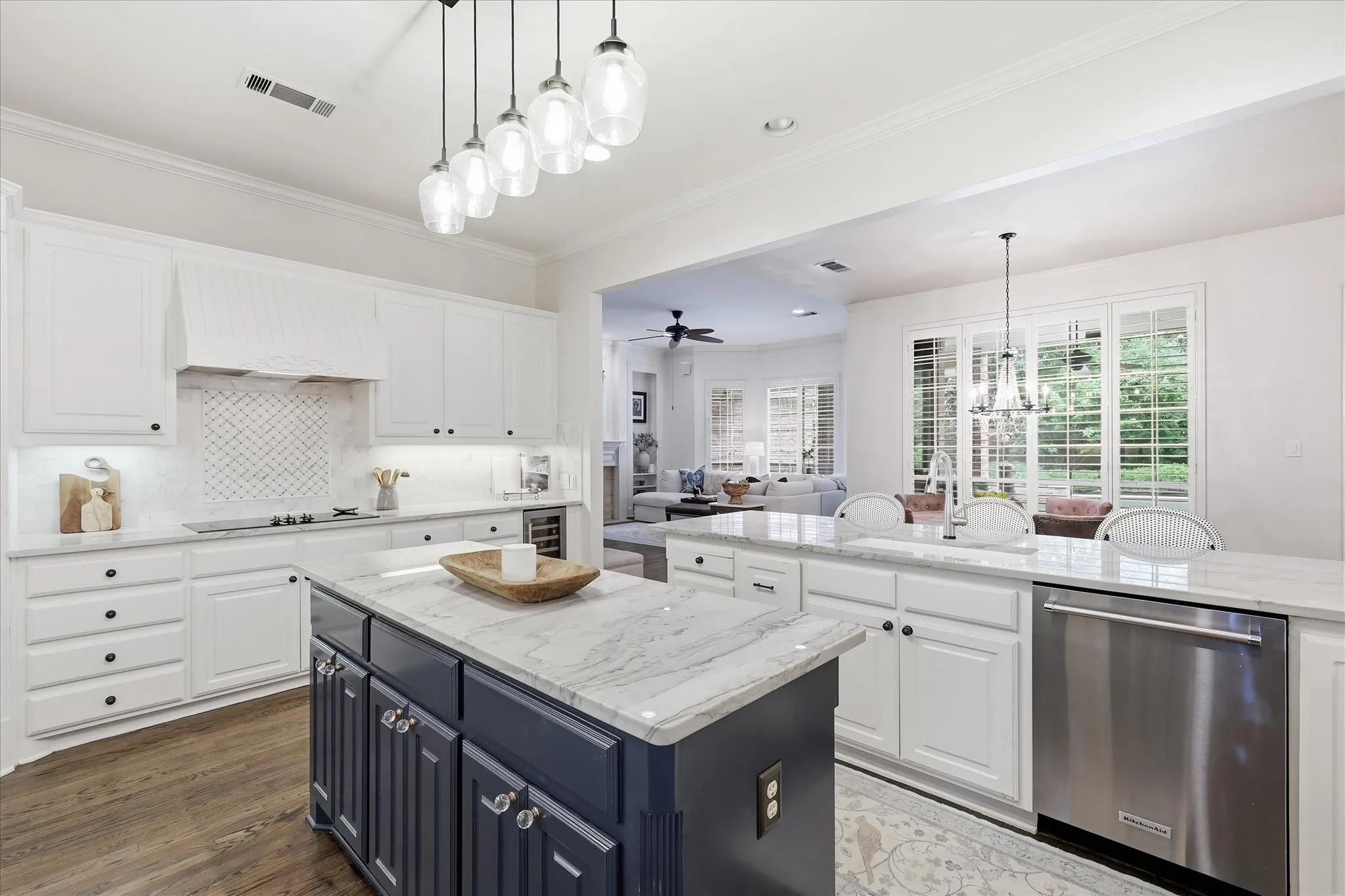 Open to the liv & brk areas is this gourmet kitchen with Quartzite tops & built-in Frig-Freezer.