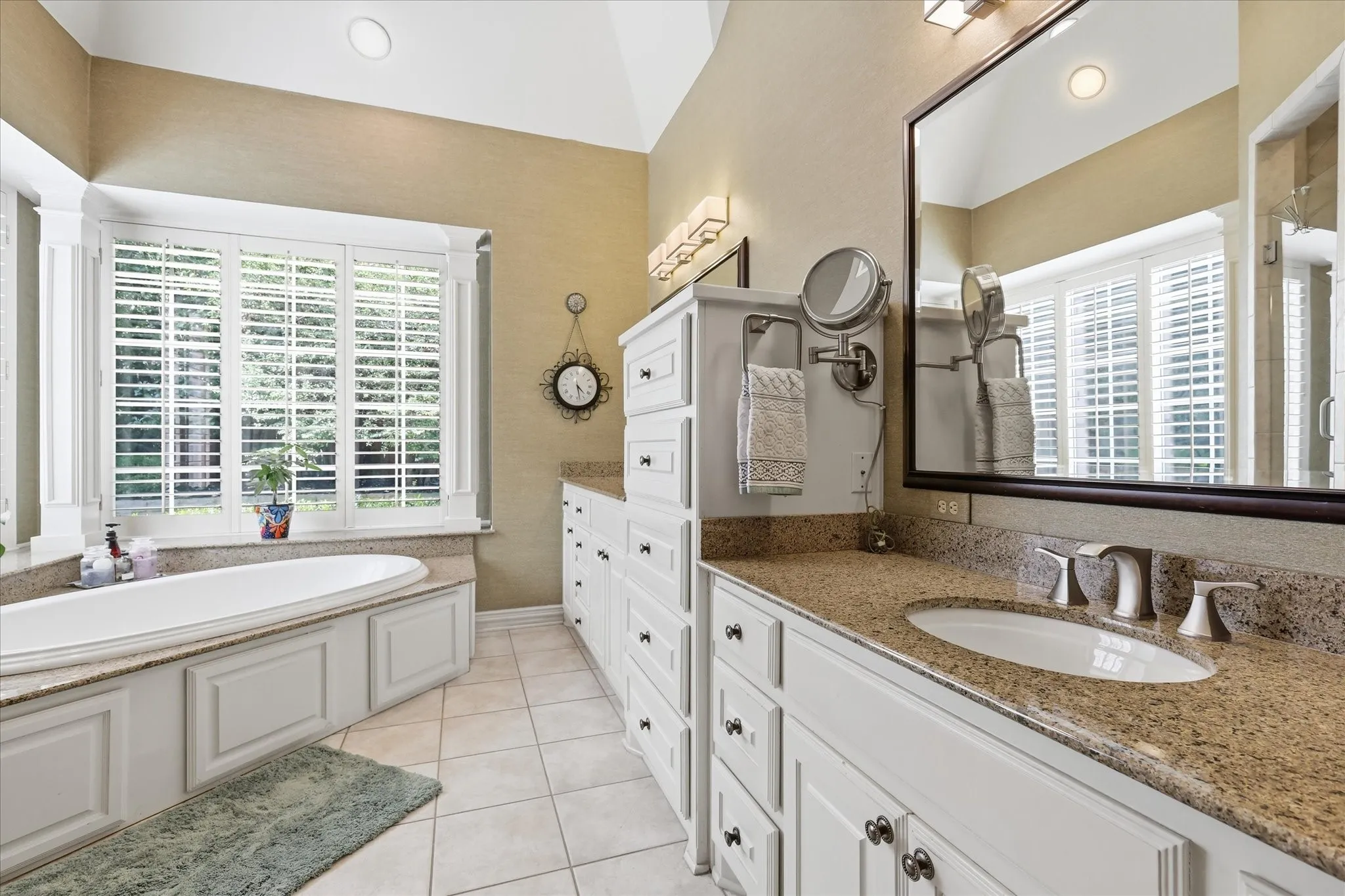 Ensuite bath has dual vanities, large jetted garden tub, walk-in shower & walk-in closet. Plenty of storage!