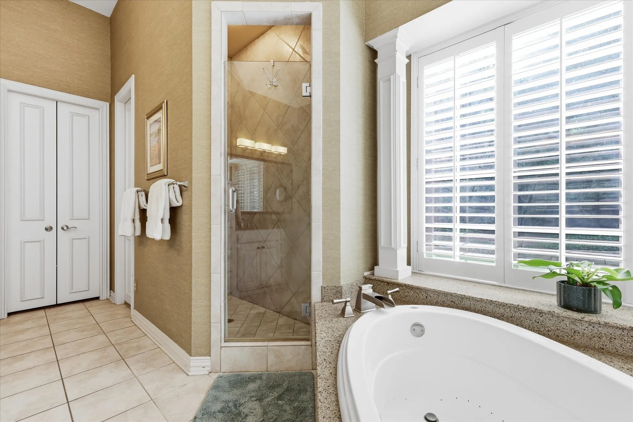 Ensuite bath has dual vanities, large jetted garden tub, walk-in shower & walk-in closet. Plenty of storage!
