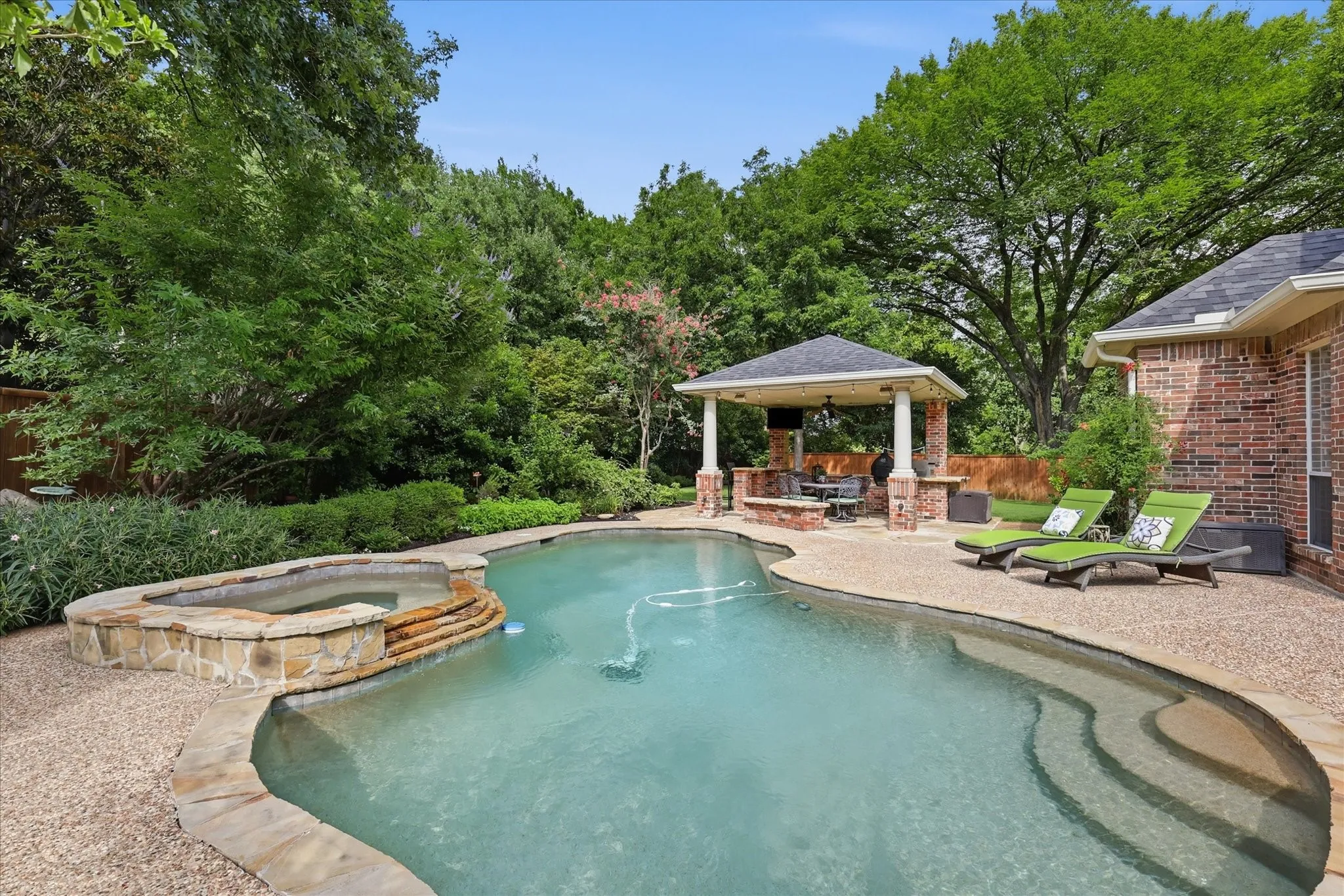 PebbleTec play pool with spa & waterfall water feature. Outdoor livng & kitchen area too. PRIVACY!