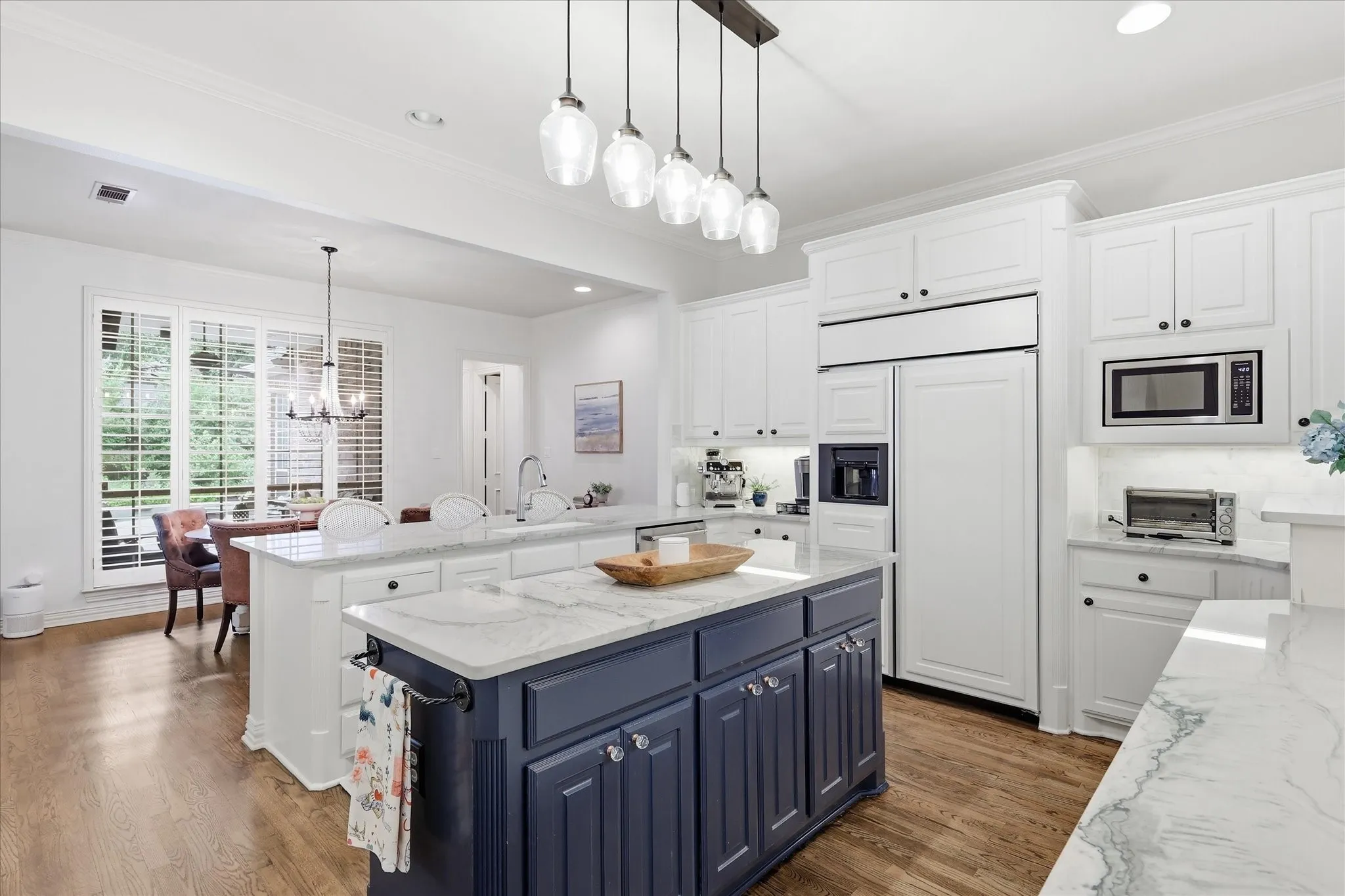 Open to the liv & brk areas is this gourmet kitchen with Quartzite tops & built-in Frig-Freezer.